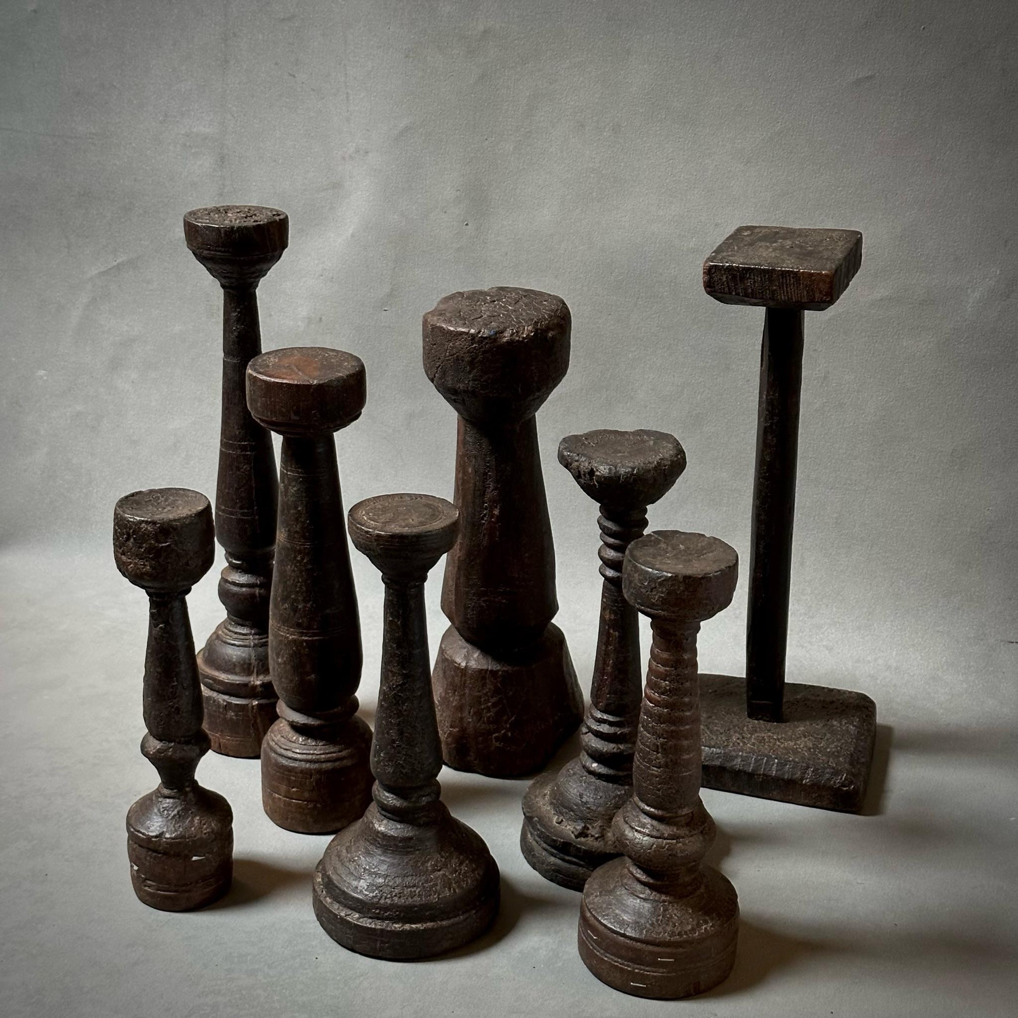 Set of eight carved wooden objects from West Africa. Earthy and elegant, these would look especially great displayed as a collection. The variations in size and shape create a dramatic sense of volume and texture. 

West Africa, circa