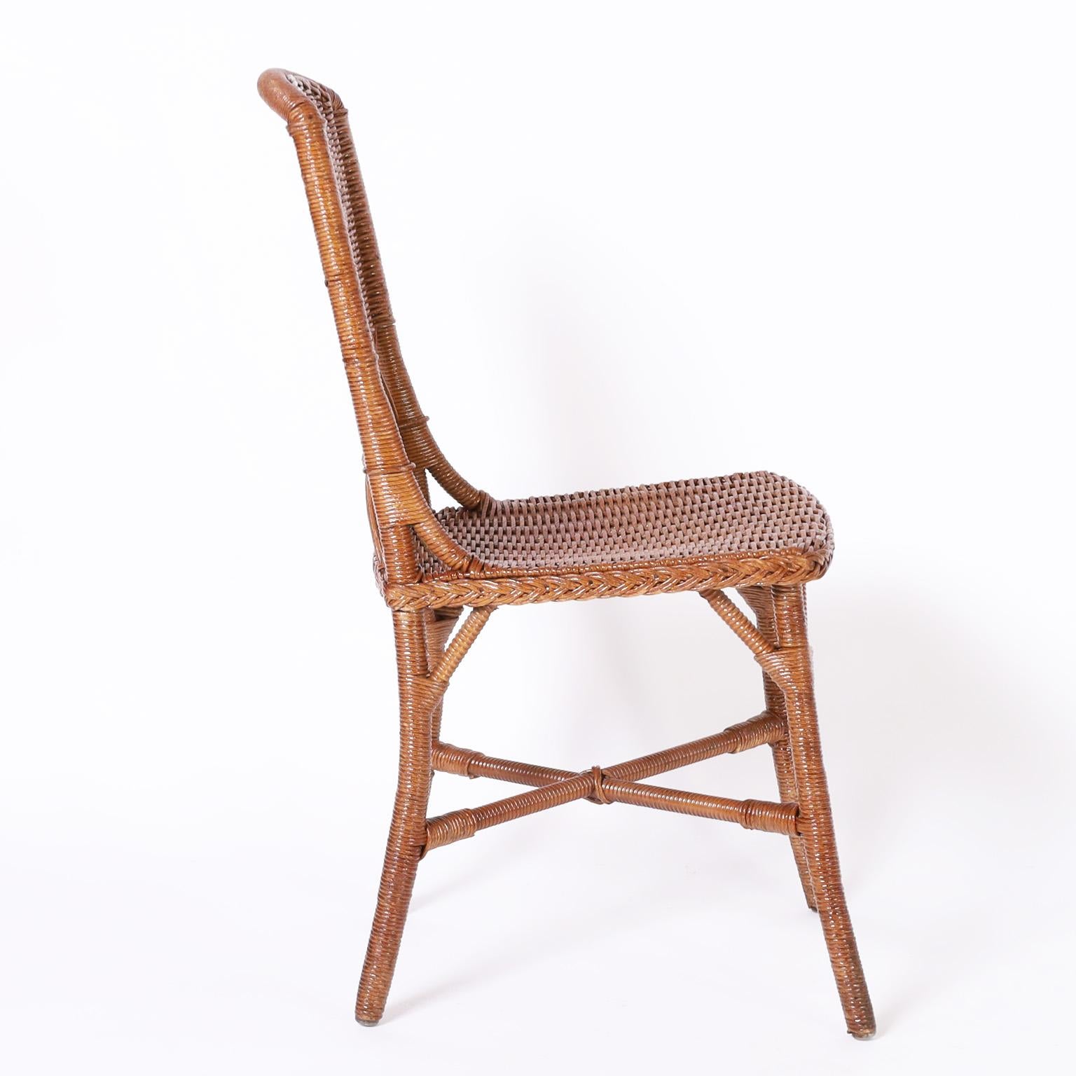 Standout set of eight wicker side chairs in remarkable condition with multiple weaving techniques, crafted with brackets and cross stretchers for durability. Originally called fiber furniture in the 1937 catalog signed Sheboygan Furniture Co. on the