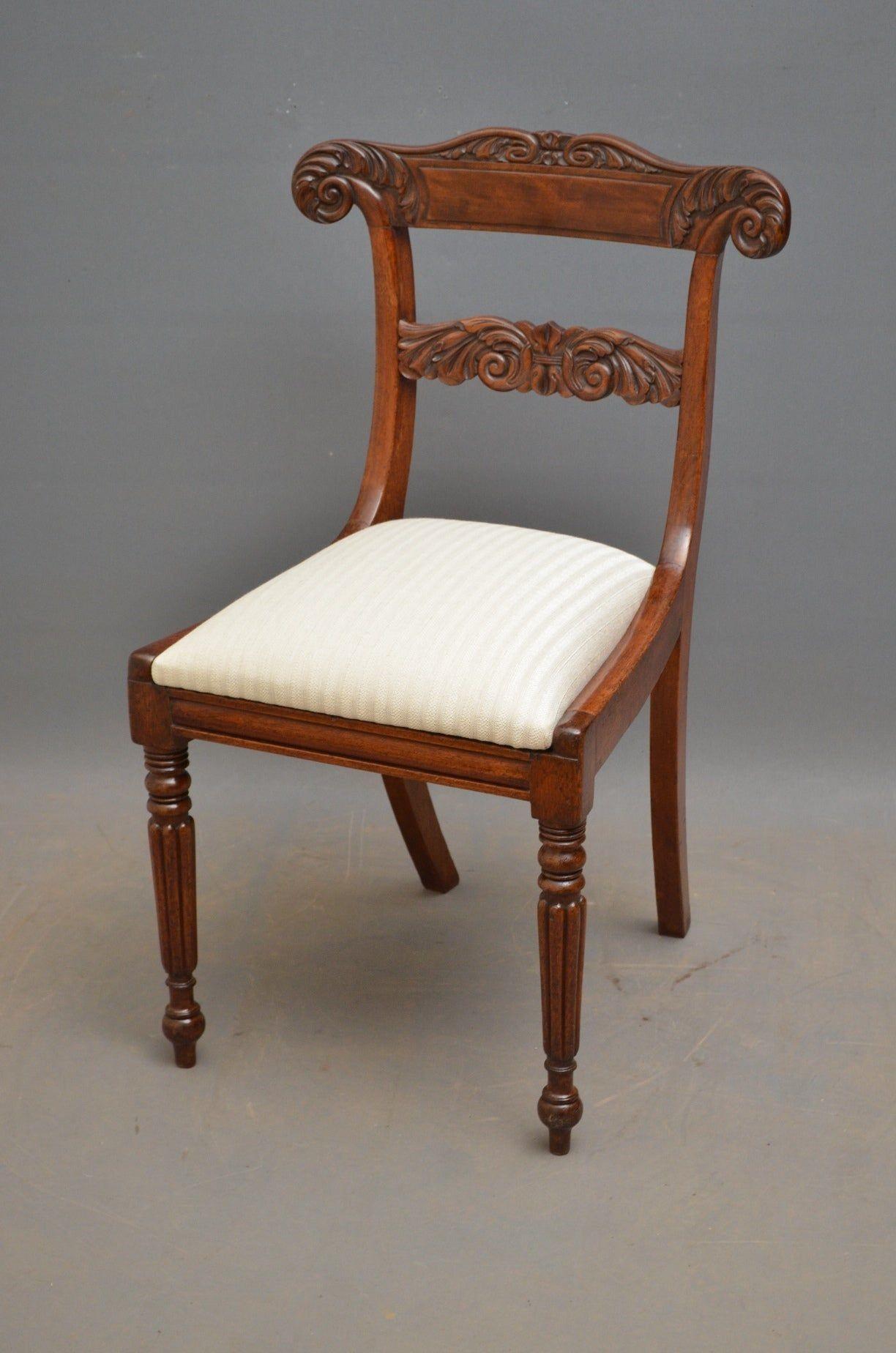 A superb quality set of eight William IV, mahogany dining chairs including two carver chairs, each having finely carved top and mid-rail with carvers having scroll open arms, all with drop-in seats and standing on turned and fluted tapering legs.