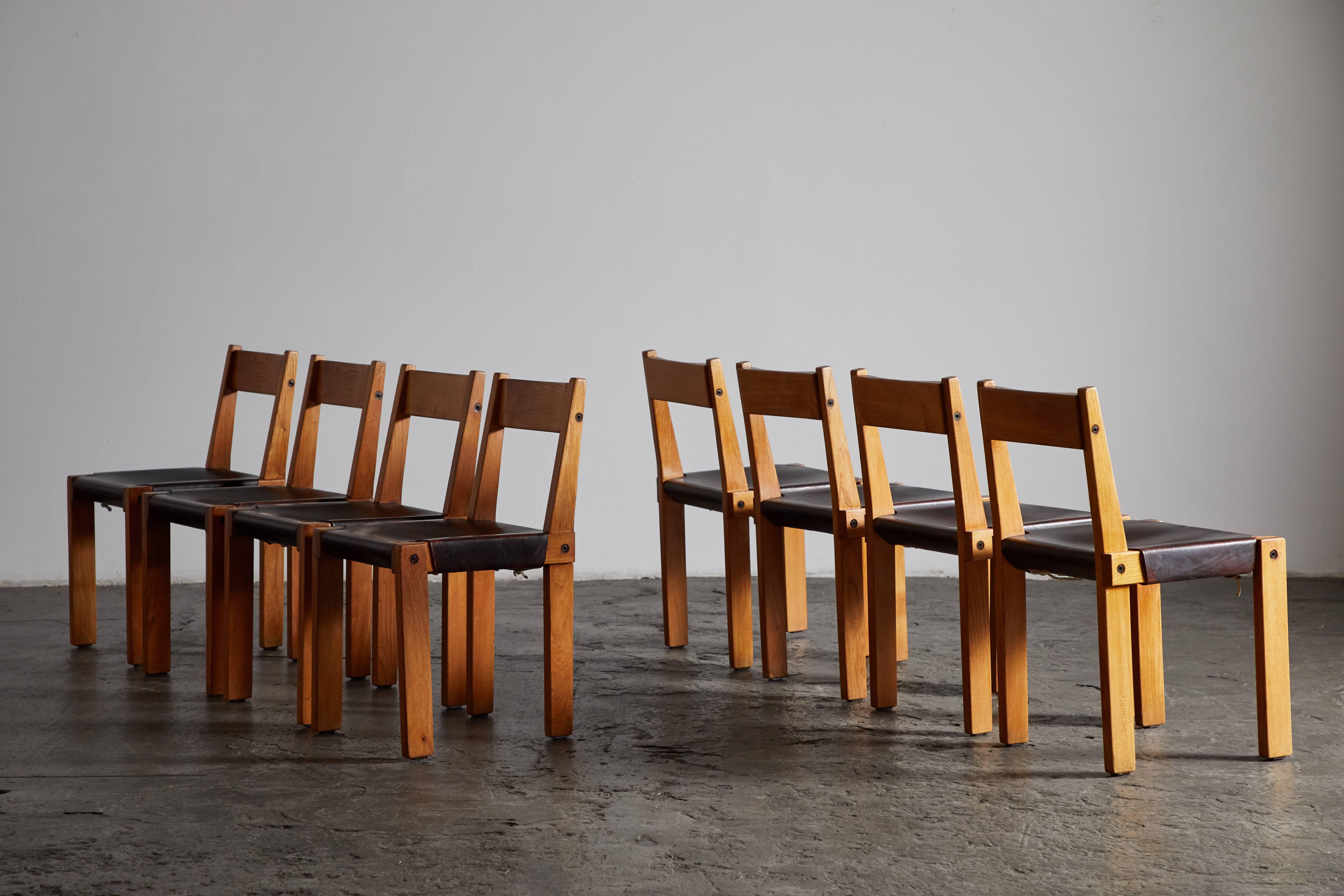 Set of eight S24 patinated leather and elm dining chairs by Pierre Chapo. Made in France, circa 1967.

 