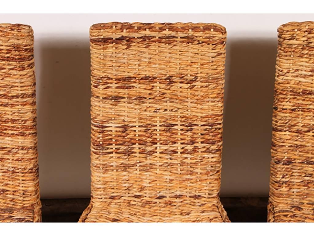 Solid wood frames with woven sisal seats and high backs. Front legs are slightly splayed. Measures: Seat height is 18.5