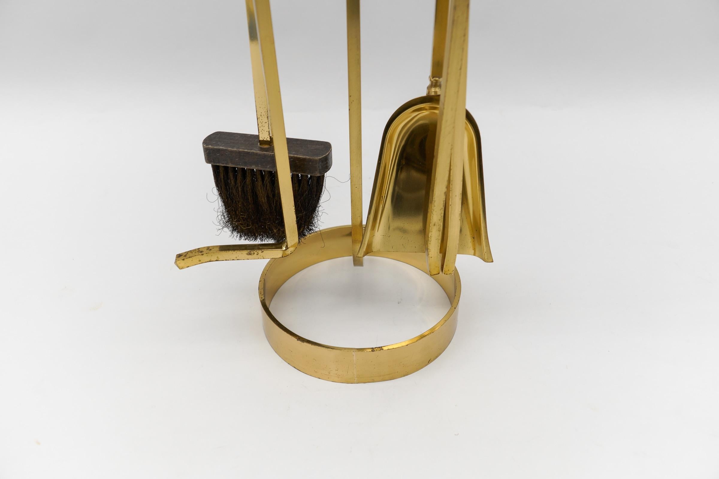 Mid-20th Century Set of Elegant Four Arts & Crafts Fire Utensils on a Matching Stand For Sale