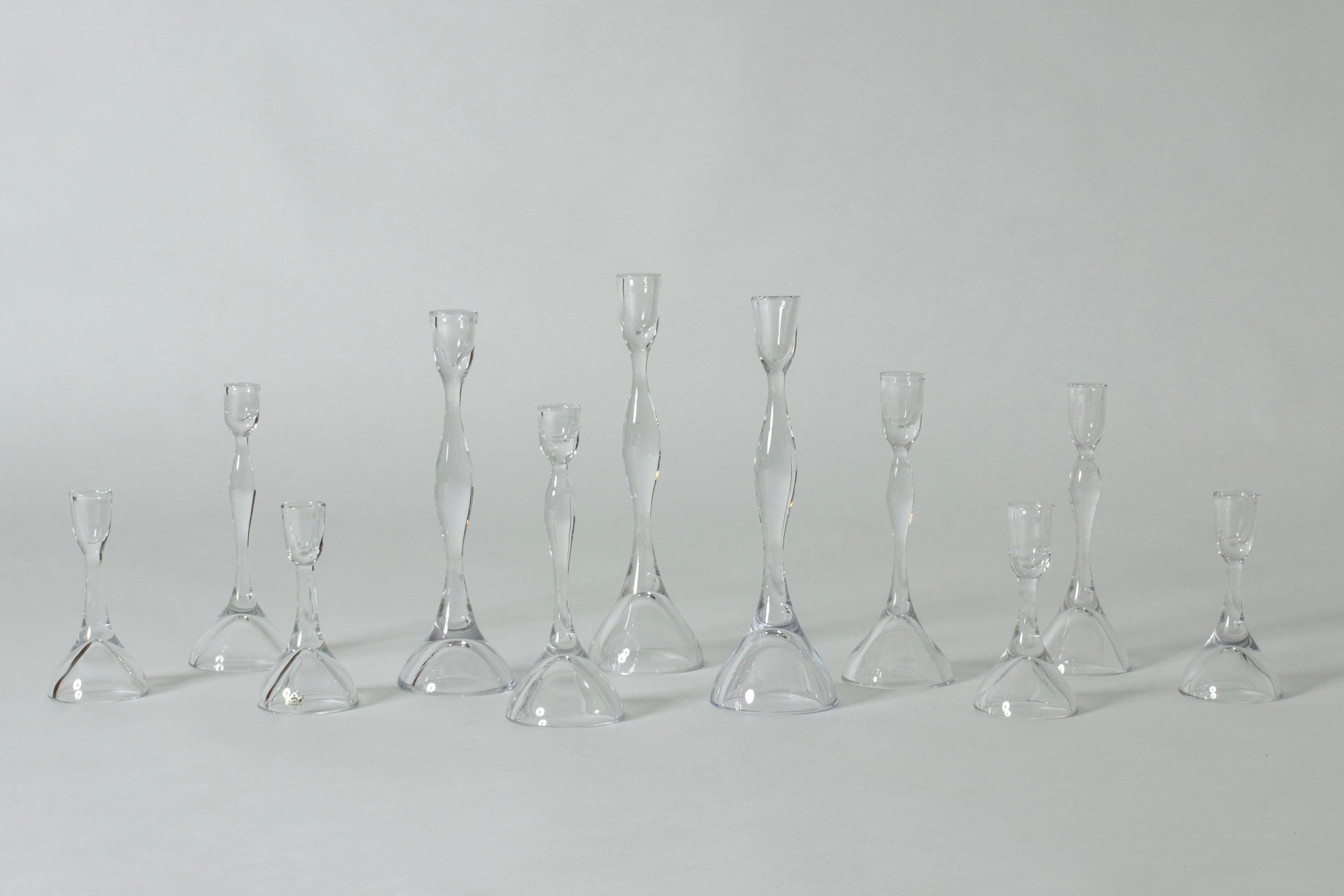 Set of eleven beautiful glass candlesticks by Vicke Lindstrand. Pure, crisp design in lucid glass. Each a slightly different size. Three tall ones, four middle sized and four short ones.

The short ones are ca 15 cm tall, the middle ones ca 22 cm