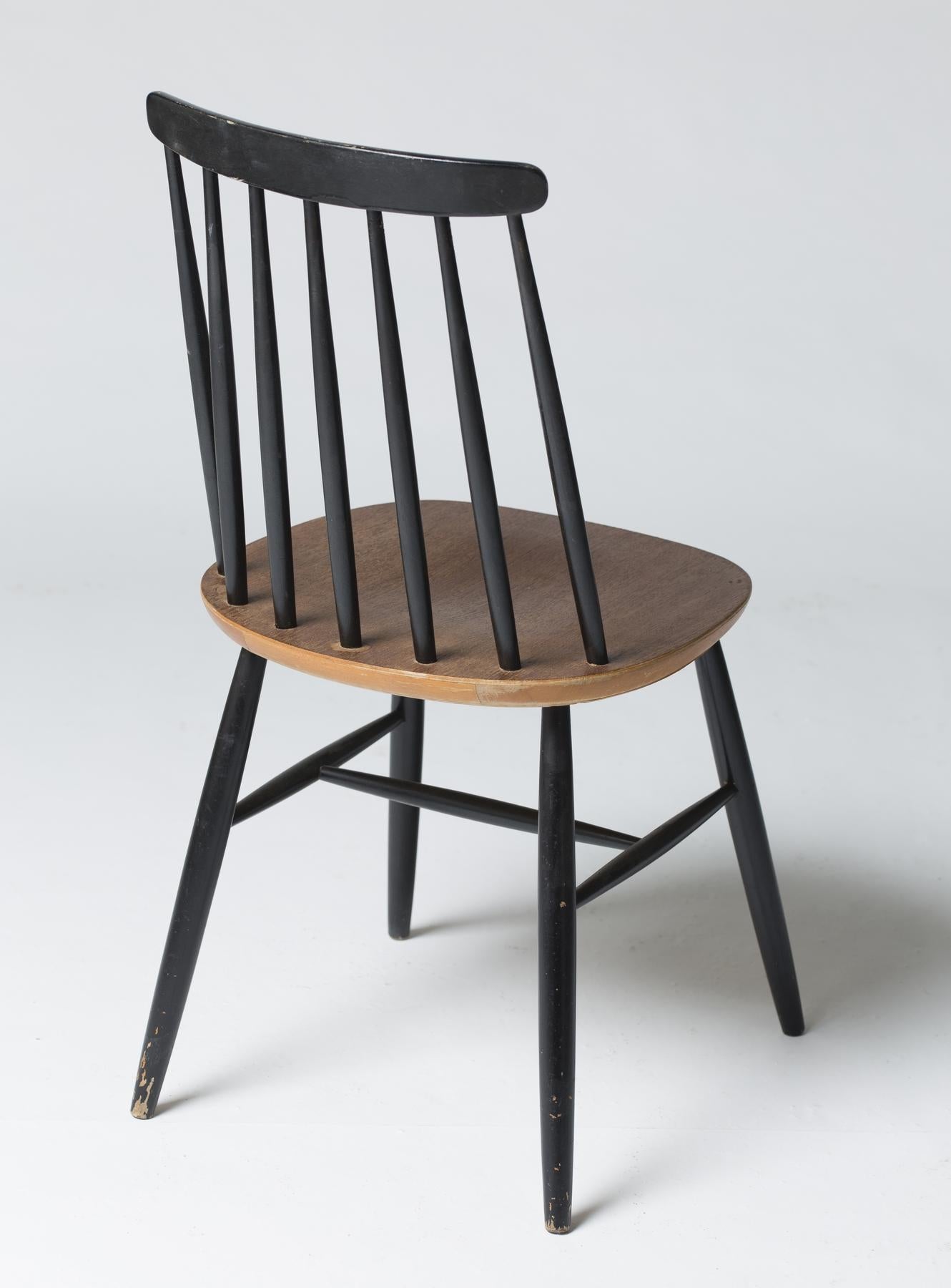 Set of eleven chairs by Ilmari Tapiovaara, in blackened wood and teak, circa 1960.

  