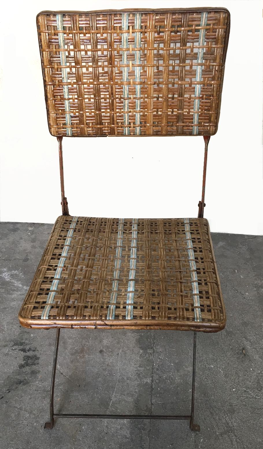 Set of eleven folding winter garden chairs, made of wrought iron and rattan with strands of painted rattan.
France circa 1900.
  