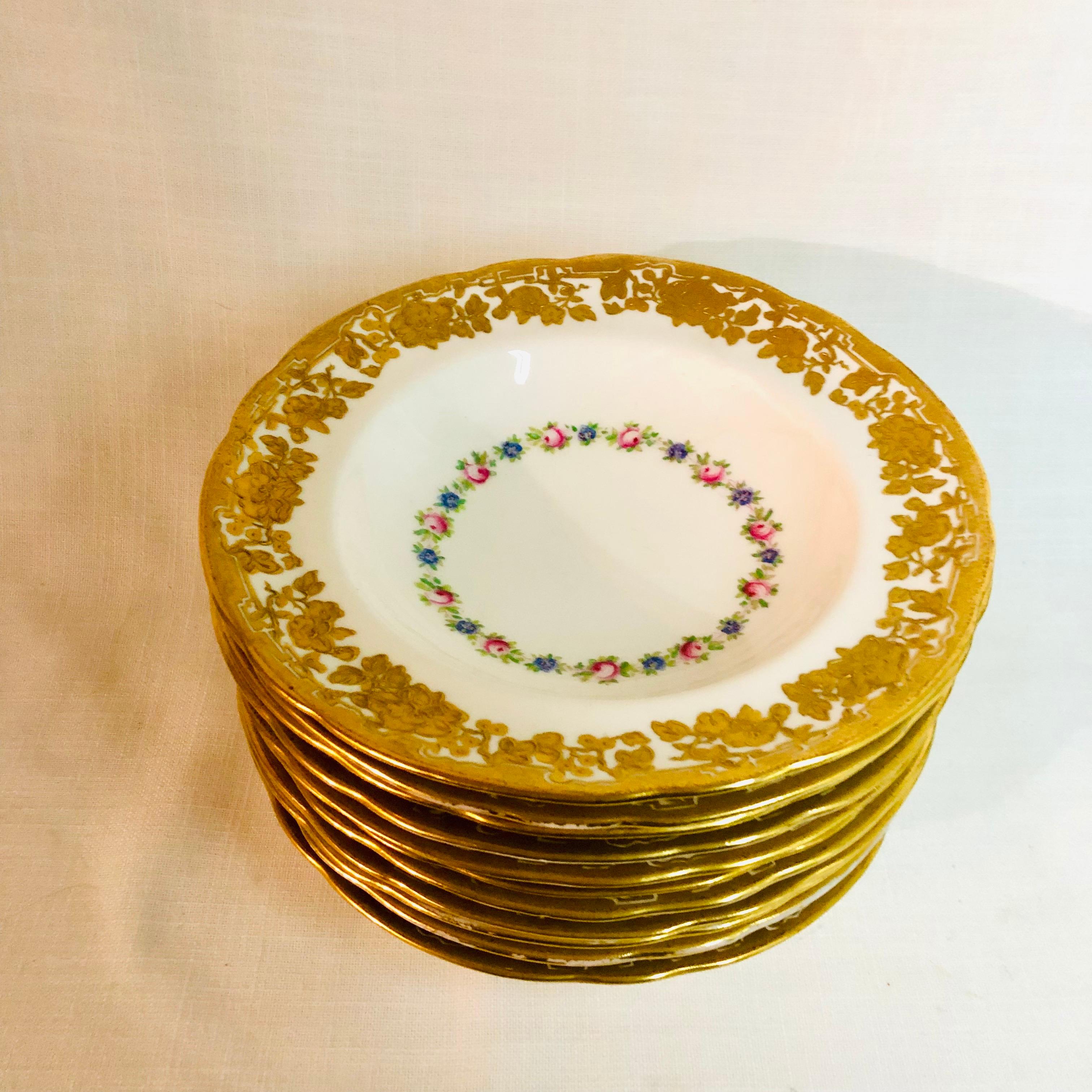 This is a beautiful set of eleven Hammersley and Company English wide rim soup bowls. They were exclusively made for Ovington Brothers in New York, which was a competitor of Tiffany and Company at the time they were made. They have raised gilded