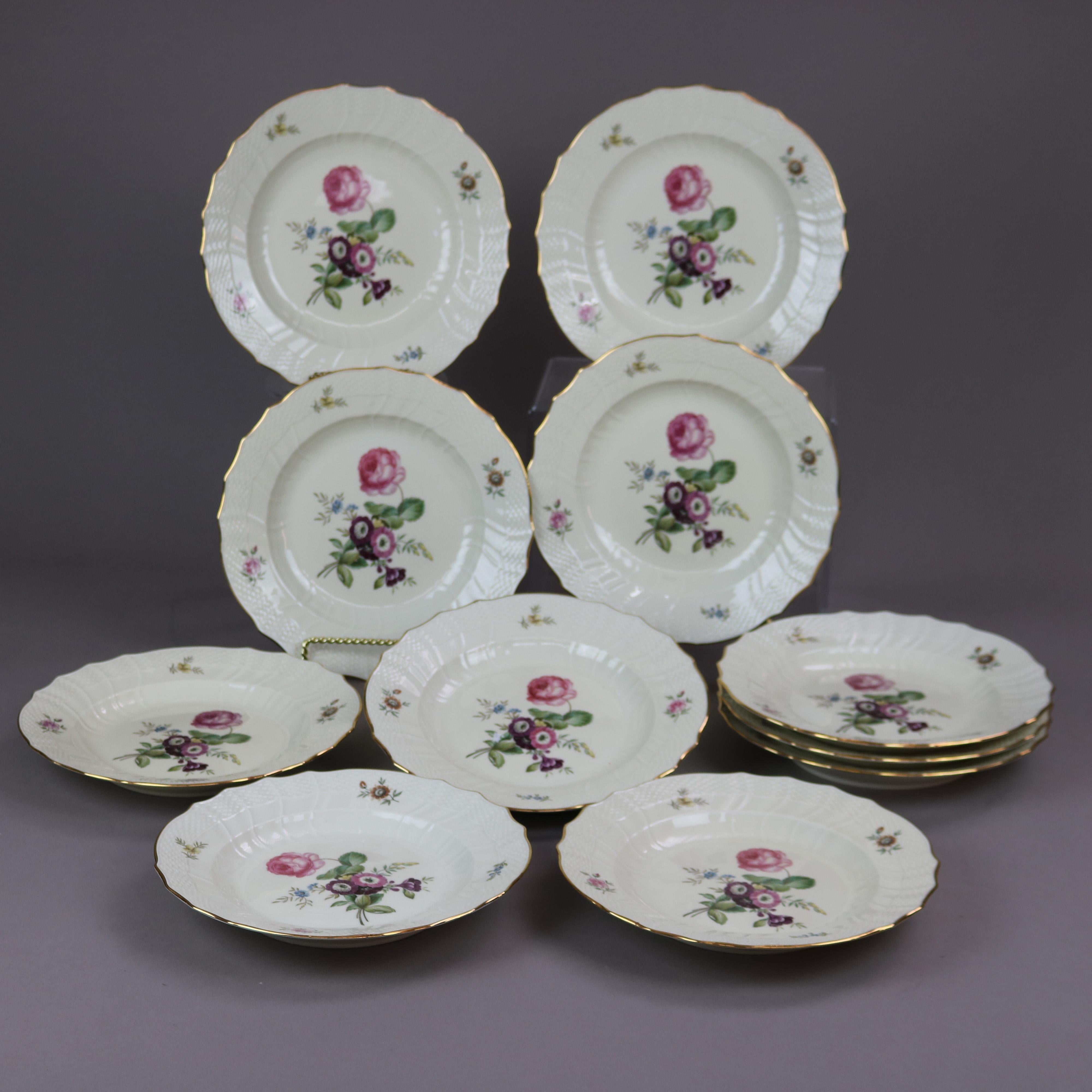 A set of eleven low bowls by Royal Copenhagen of Denmark offer porcelain construction with reserves of garden flowers & gilt trim, Pattern 910 Frijsenborg, maker mark on base as photographed, c1940. 

Measures - 1.5''H x 10''W x 10''D.