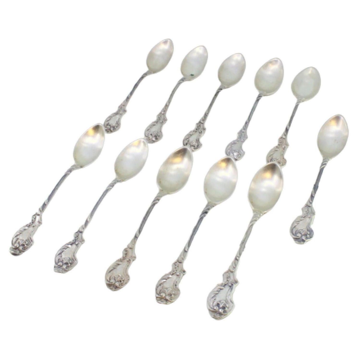 Set of eleven silver teaspoons with reliefs and shell handles