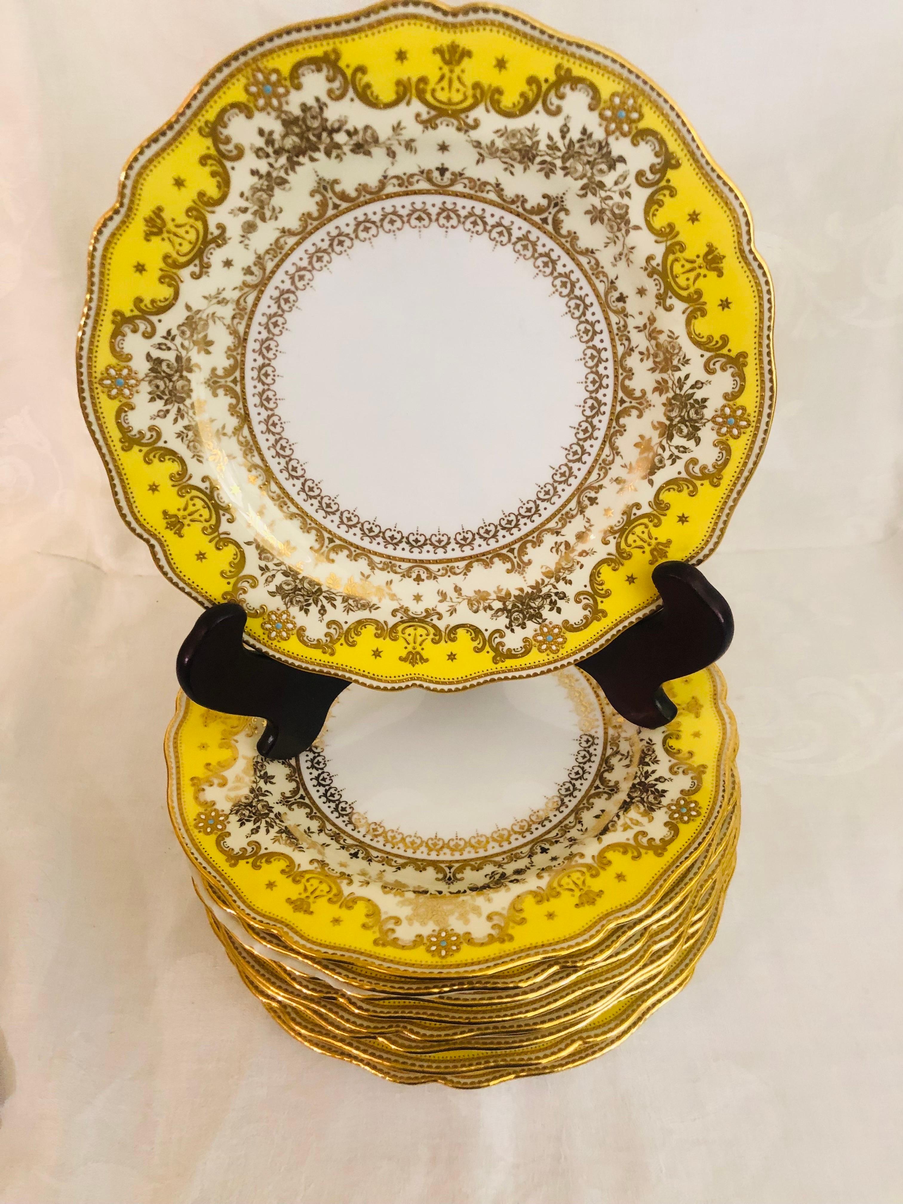 Gilt Set of Eleven Yellow Spode Copeland Jeweled Dinner Plates with Raised Gilding