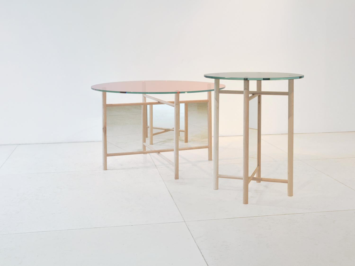 Set of Elias and Son tables by Llot Llov
Dimensions: 
Elias: Ø 80 x H: 50 cm
Son: Ø 48 x H 60 cm
Materials: Beech, mirror, glass

If you look at the ELIAS and SON tables from afar, the mirrors that are attached within the inner frames are making it