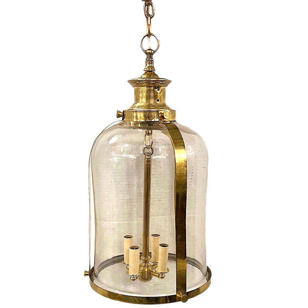 A set of 7, circa 1950's English bronze lanterns with glass insets and four interior lights. Sold individually.

Measurements:
Height: 25”
Diameter: 11”