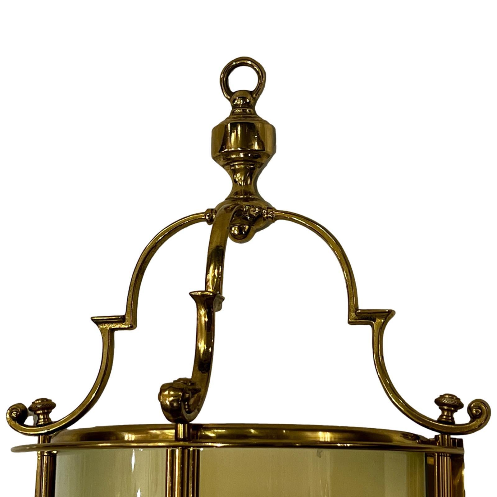 Pair of English bronze wall lanterns with glass panels and two interior lights each. 

Measurements:
Height: 19
