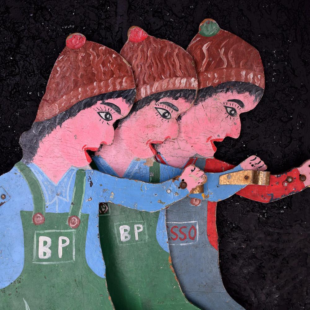 We are proud to offer a unique and highly decorative set of double sided English Folk Art fairground ride figures. In the form of 4 mechanics dressed in Esso and BP petrol station overalls. Dating from the mid- 20th century these vibrant examples