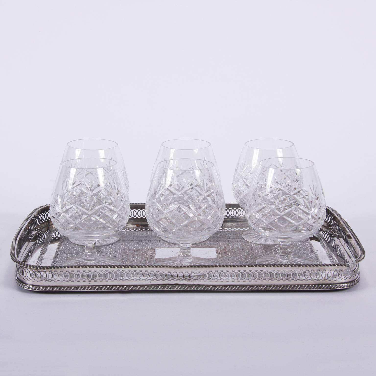 English mid-20th century

A set of six cut-glass brandy balloons in great condition.

Tray is no longer available.