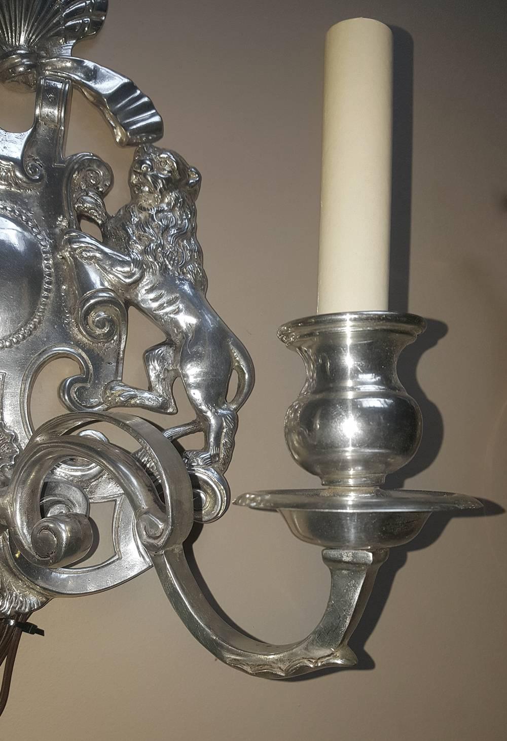 Set of four English silver plated 2-arm neoclassic style sconces with lion and shell motif.
Measurements:
Height 14