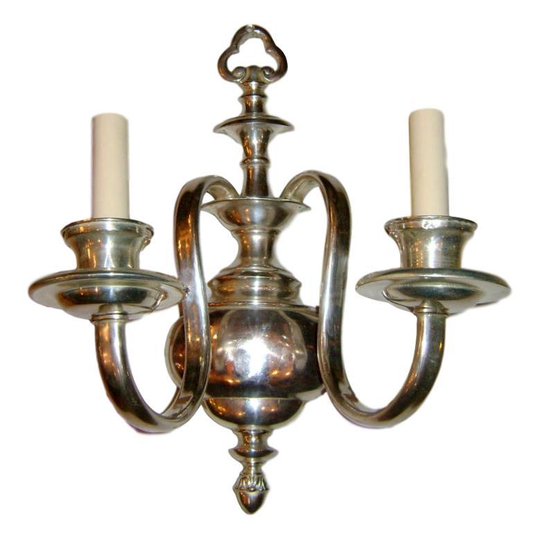 Set of six English circa 1920s neoclassic style silver plated two-arm sconces. Sold per pair.

Measurements:
Height 16.5