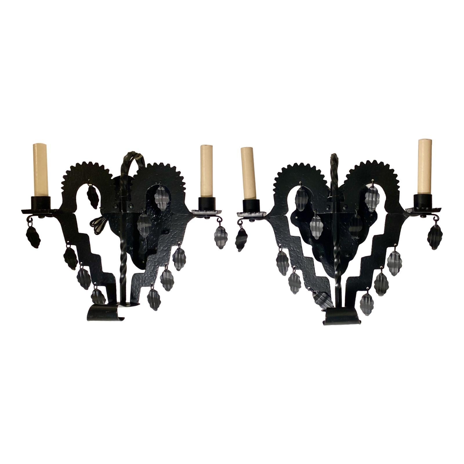 Set of eight English circa 1920's hammered iron arts and crafts wrought iron two-arm sconces with pendant leaf-shaped decorations. Sold per pair.

Measurements:
Height: 13