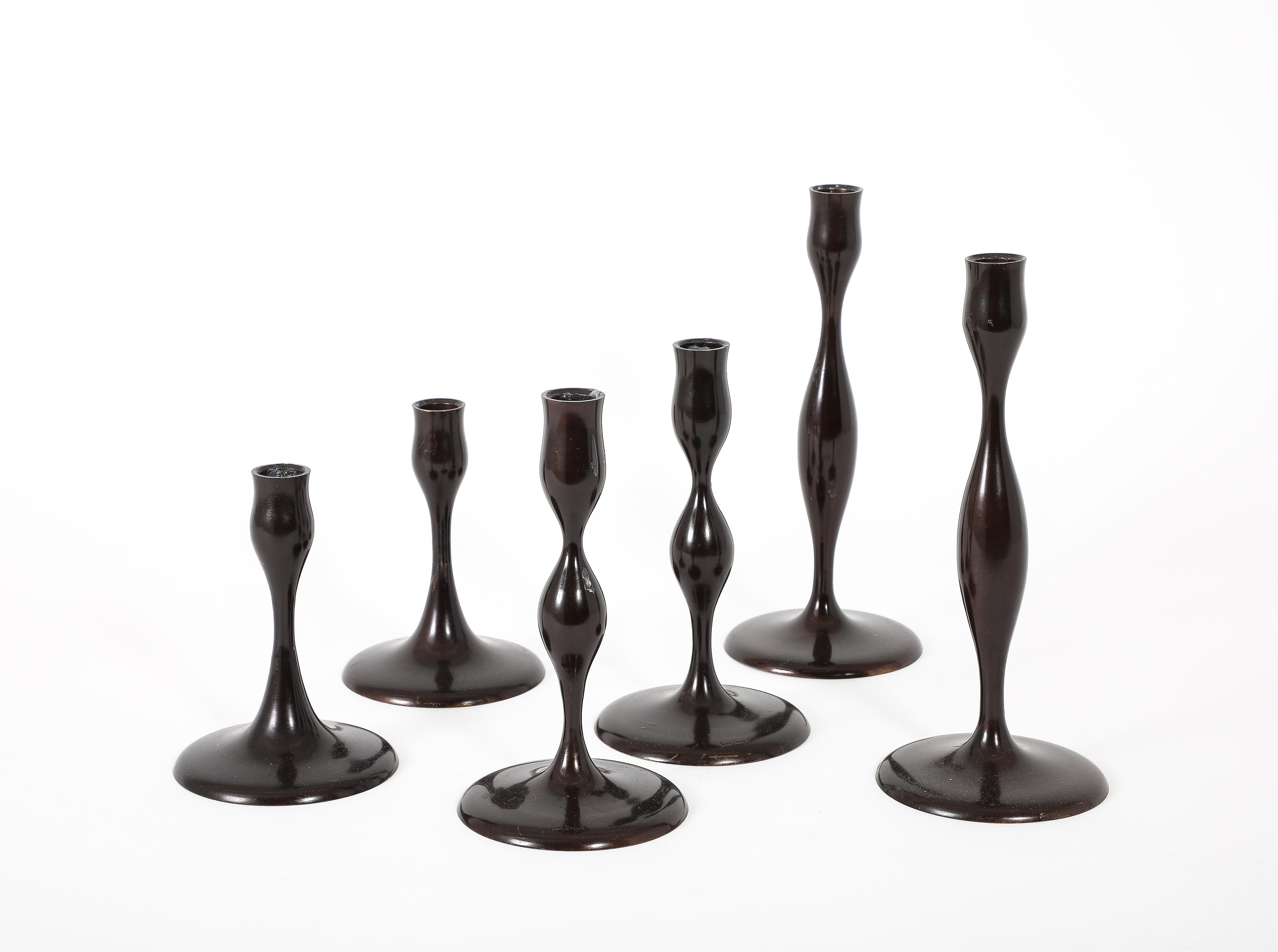Rare set of Bronze candlesticks by Eva Zeisel in 2007 at 101 years of age, this is the complete set of sizes at 6”, 8” and 11”, From the “Originals” line, signed to base and no longer in production.
