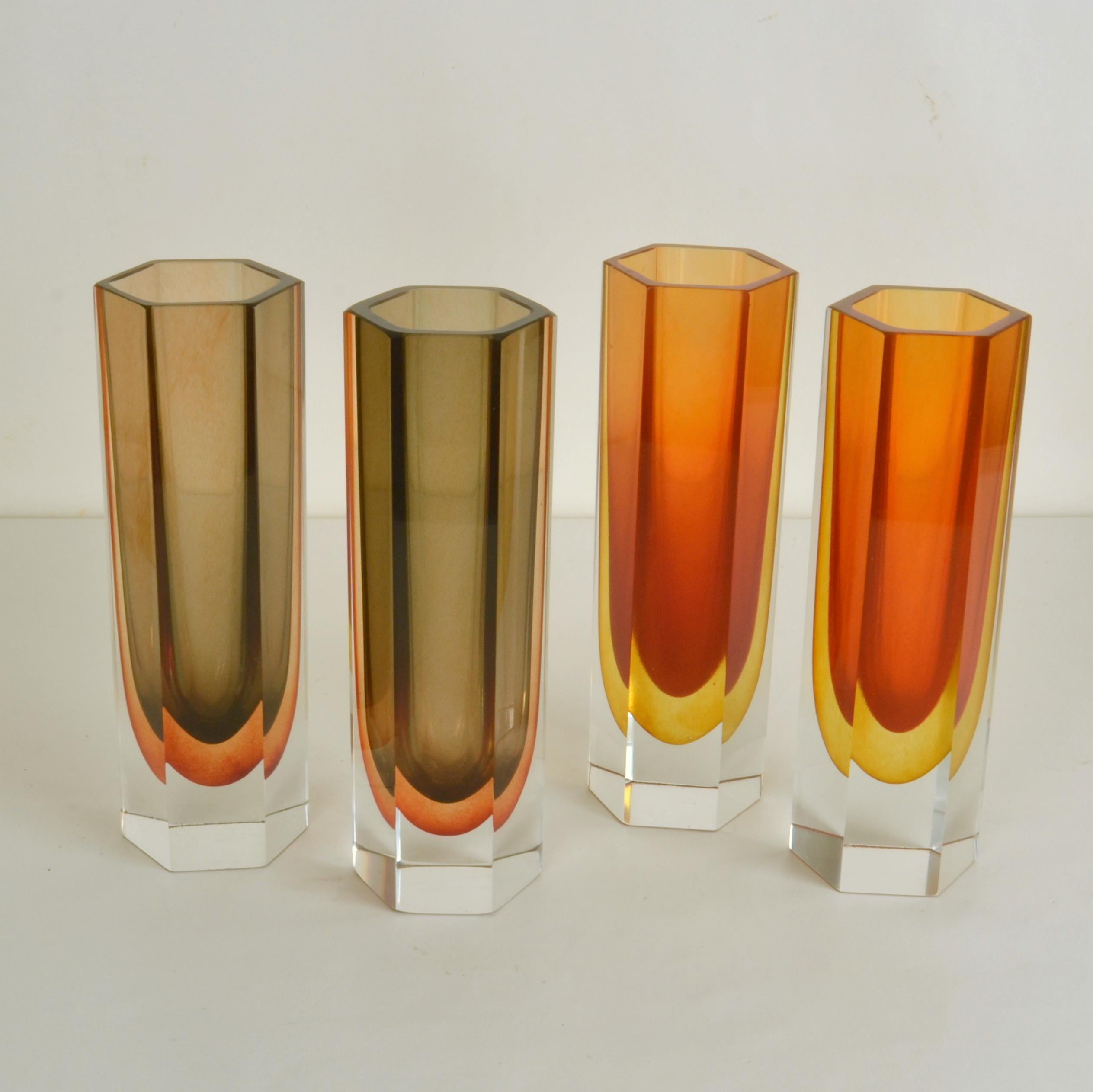Set of four hand blown and cut tubular vases in burned orange and brown in equal heights in the style of Seguso. 

Individual heights; 23 cm, widths; 8 cm. 
 