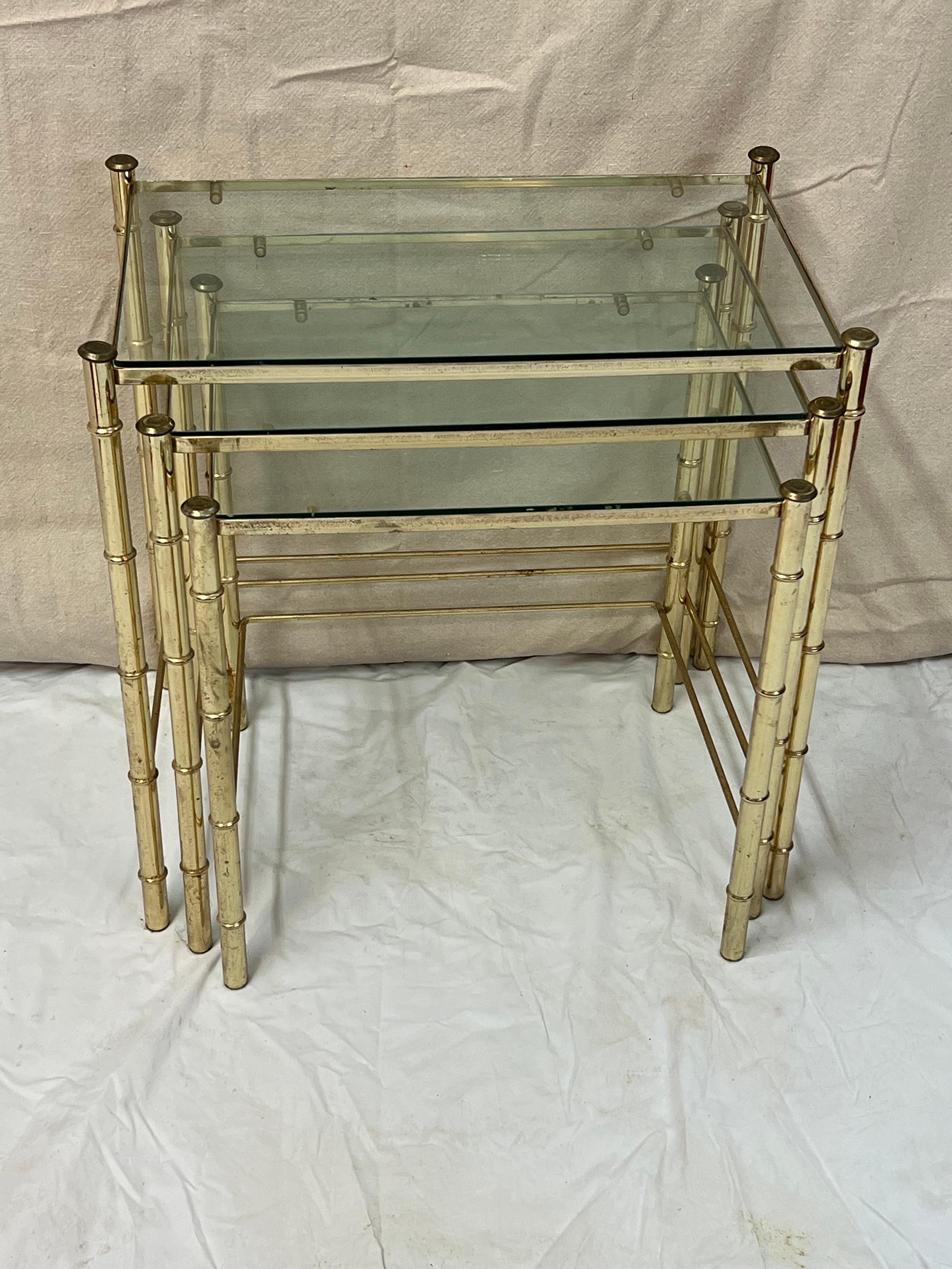 Set of Faux Bamboo Brass bamboo nesting tables with glass  In Fair Condition For Sale In Redding, CT