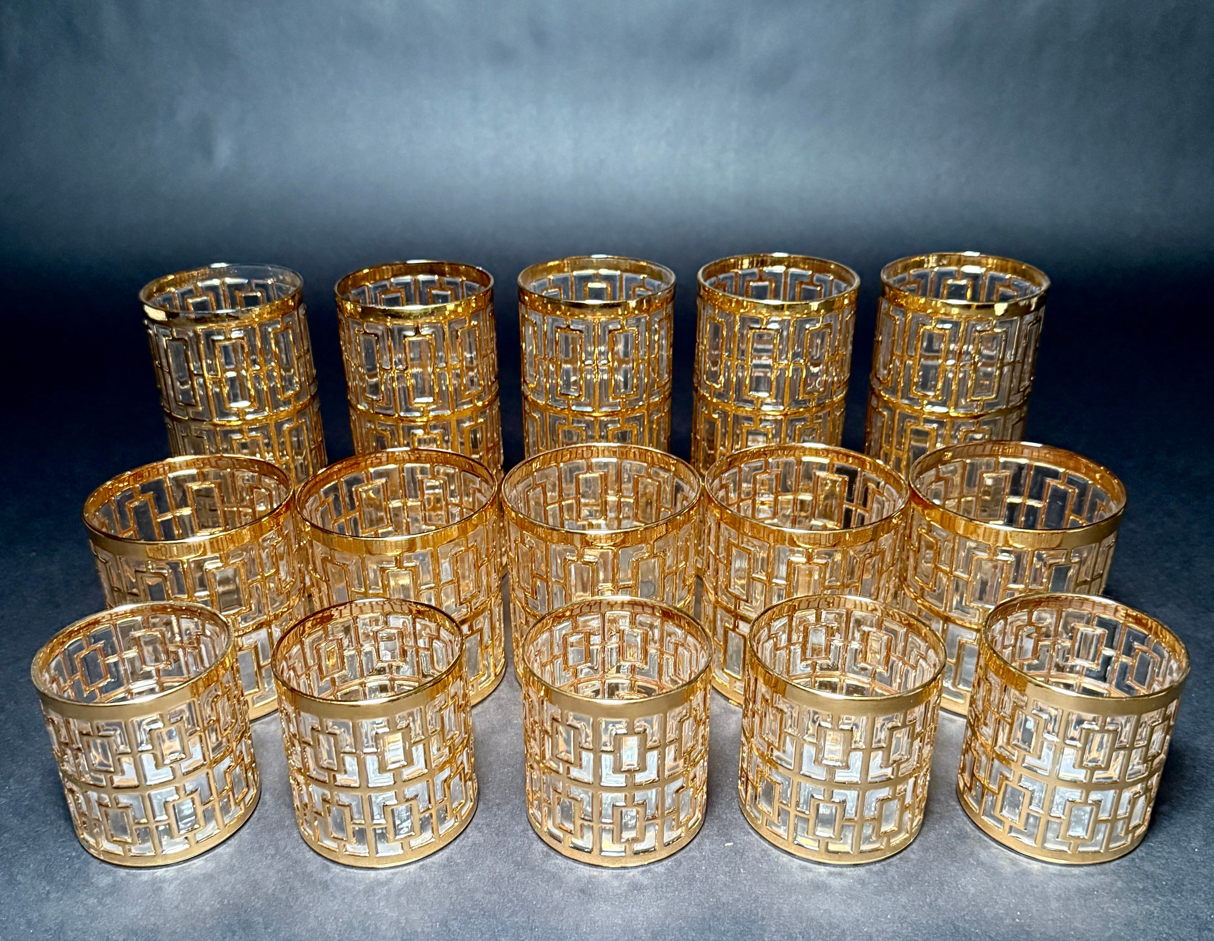 An exceptional set of fifteen mid-century tumblers by Imperial Glass Co., in the sought-after Shoji Trellis pattern. Each glass is decorated with an intricate 22-karat gold overlay in a bold geometric lattice motif, reflecting light beautifully and