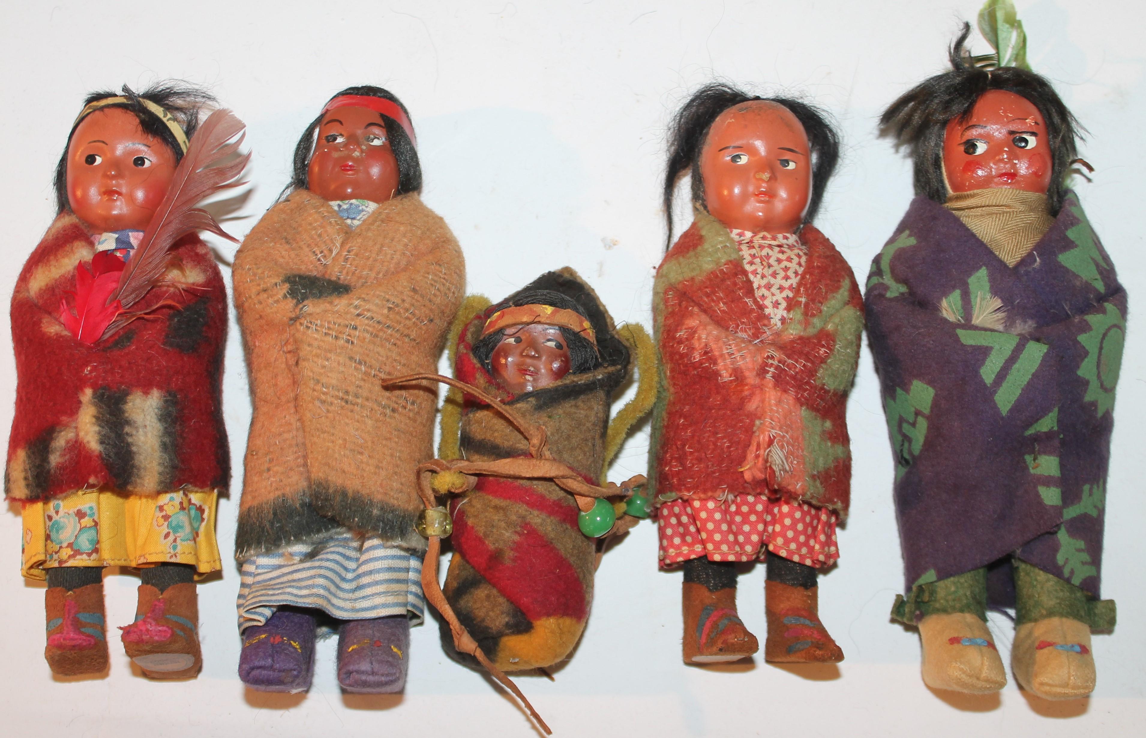 Set of five 1930's - 40's children skookum dolls. The Dolls have Real Hair and are Wearing Indian Design Beacon Blankets.
Largest measures - 7.5 tall x 2.75 wide
smallest measures - 4.5 tall x 2 wide.