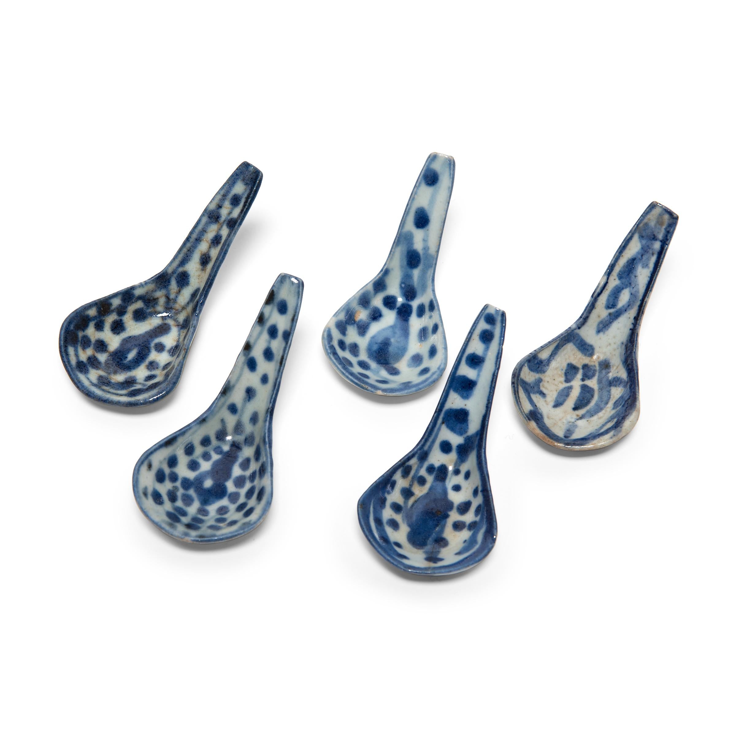 Each a delicate example of blue and white ceramics, these 19th century porcelain soup spoons were likely used as everyday eating utensils. Used in China as early as the Shang dynasty (1600-1046 B.C.), spoons predated chopsticks and remained the most