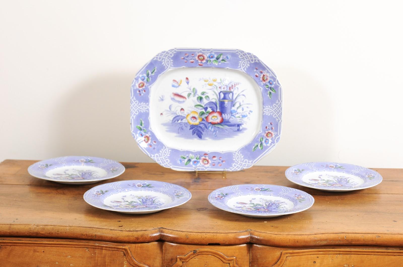 A set of five English ironstone dishes from the 19th century, with rare floral pattern. Created during the 19th century, this set of five ironstone dishes features four plates (each measuring 10