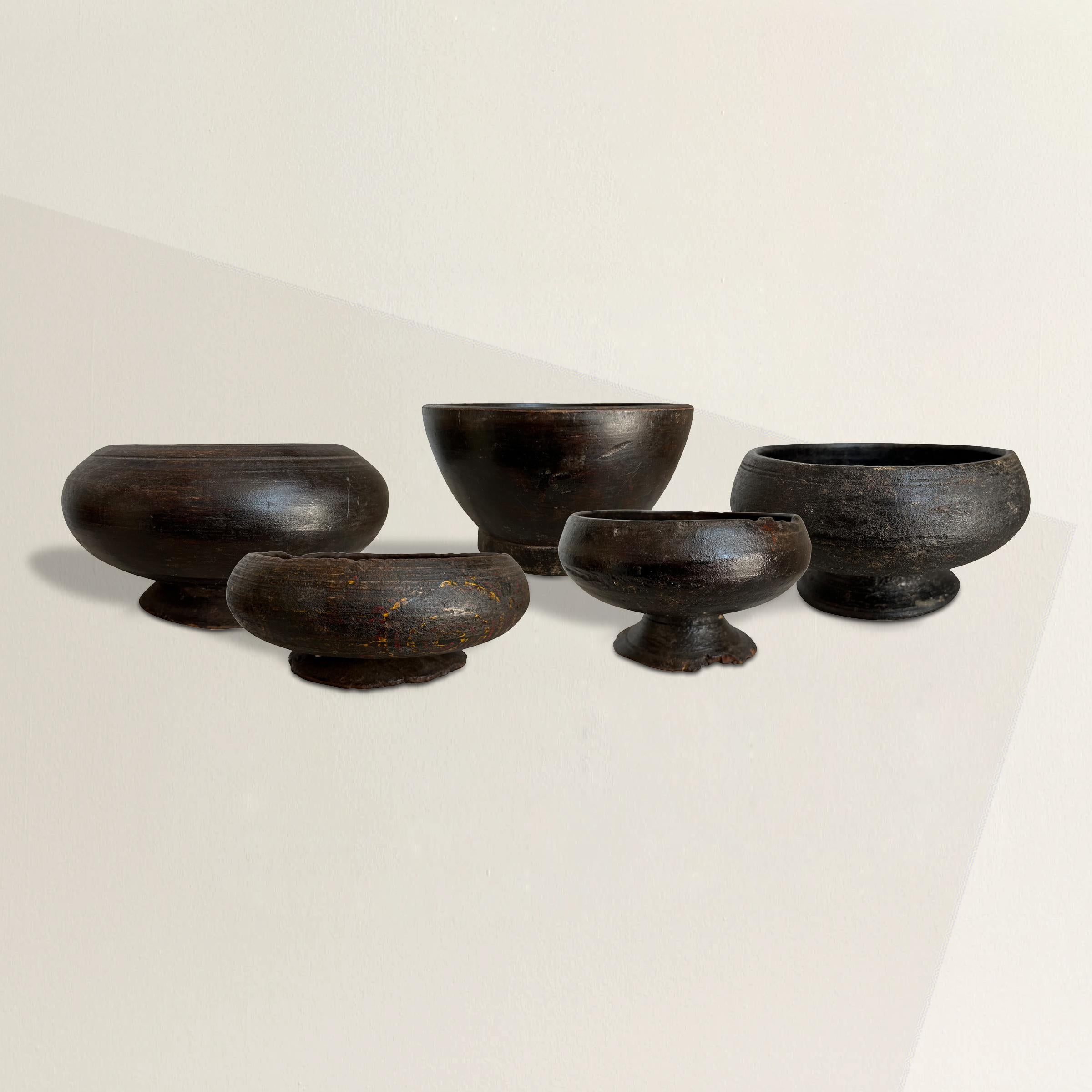 A remarkable set of five 19th century Tibetan Buddhist alms bowls originally used by monks to collect food and money donations from patrons of their temple. Now, they're a wonderful reminder that giving is better than receiving. Dimensions listed