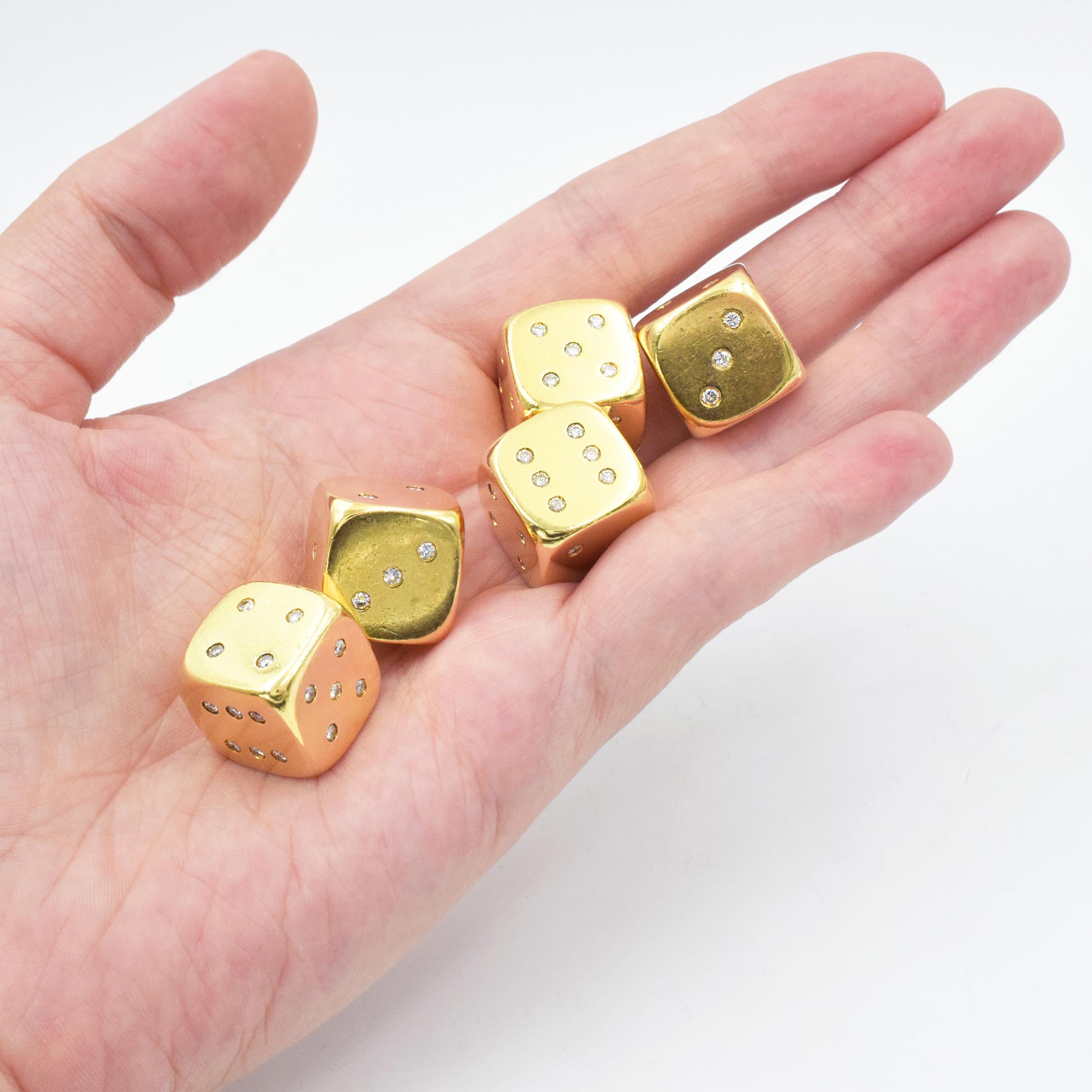 Set of five 22k yellow gold and diamond dice. Diamonds: 105 round diamonds with approximate total weight of 3.10 - 3.40 carats, Size/Dimensions: 1.5 cm square (5/8 in).
Total weight: 102.7 grams