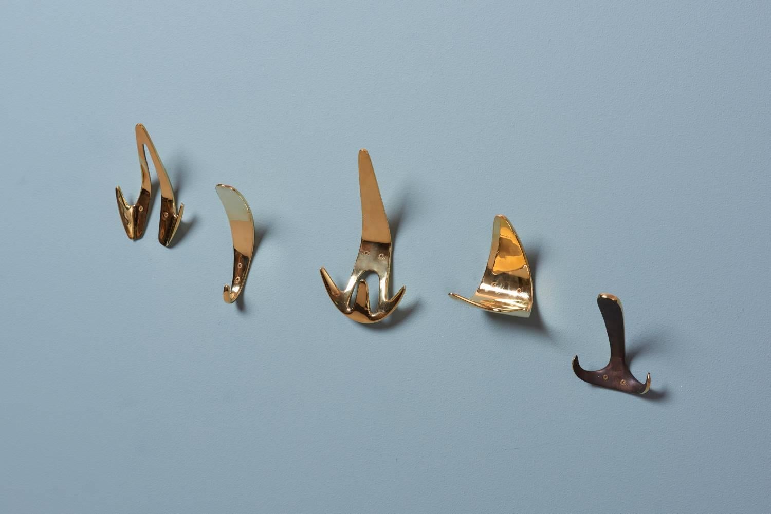 Polished Set of Five #4327 Wall Hooks by Carl Auböck For Sale