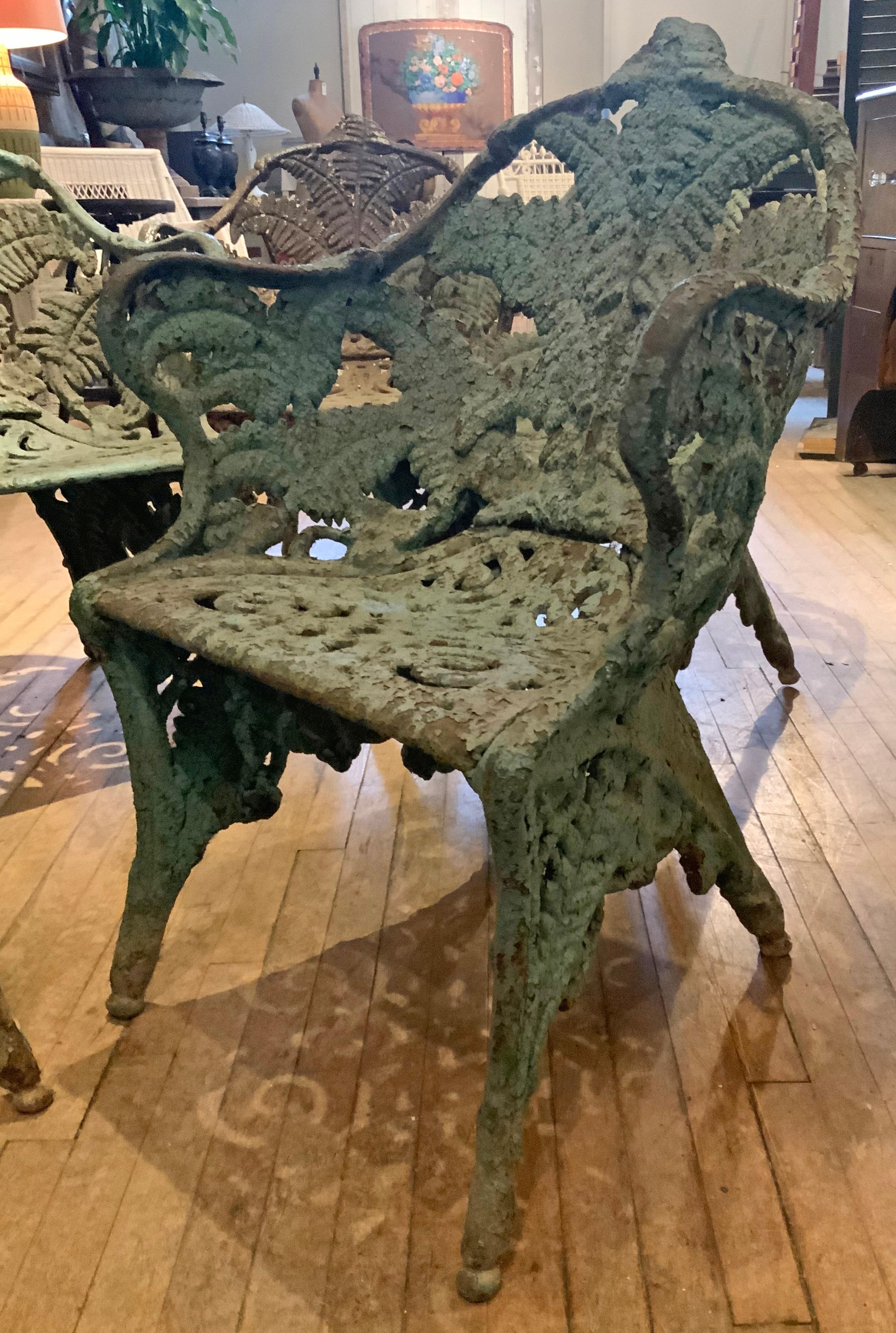 A remarkable set of 5 cast iron Fern garden chairs. The pattern originated in the Coalbrookdale Company Firms catalogue in 1875. These are the heaviest and most well made of these beautiful antique chairs. 

Four of the chairs share the same