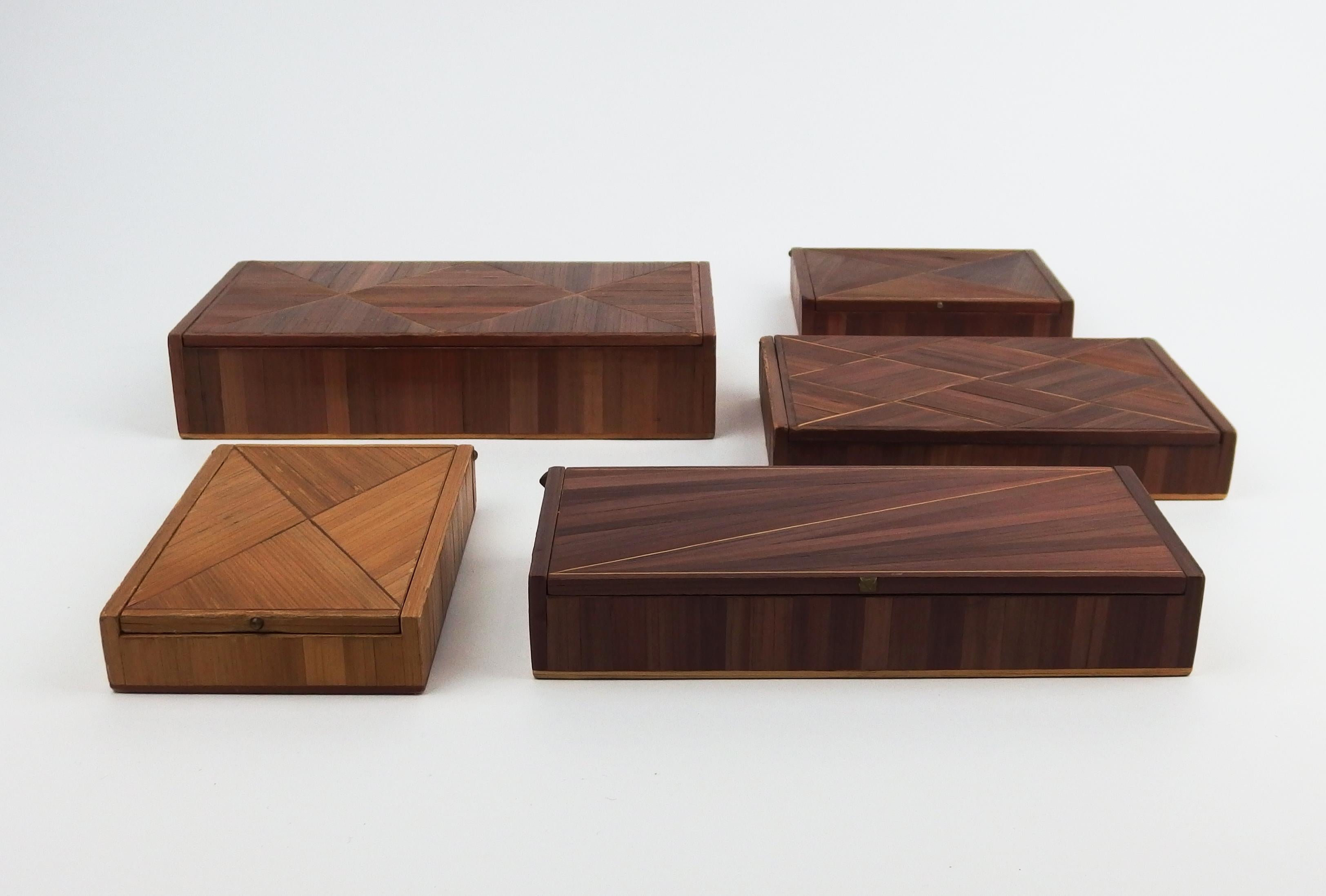 Collection of five Art Deco straw marquetry boxes with different finshings: wood or cork veneer inside, straw marquetry or leather imitation cardboard on the bottom. These type of boxes is often attributed to Jean-Michel Frank.
Small boxes
