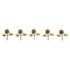 Set of five beautiful, solid mid-century brass rose wall coat hooks