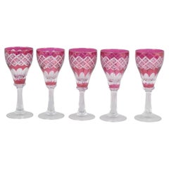 Set of five Bohemian pink crystal wine glasses with cut decoration. 1940s