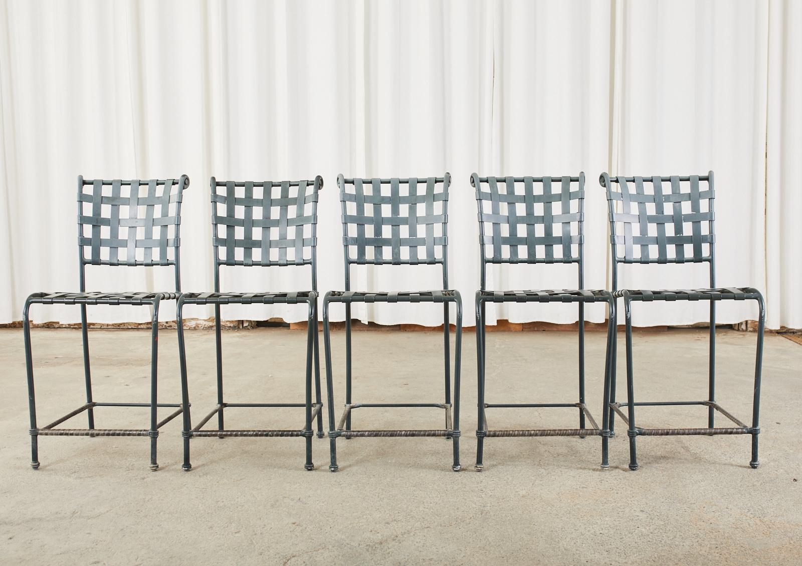 Classic set of five aluminum counter height bar stools designed by Brown Jordan from their Florentine collection. Crafted from wrought aluminum with a dark jade green anodized finish. The seat and back have a lattice design of aluminum straps with a