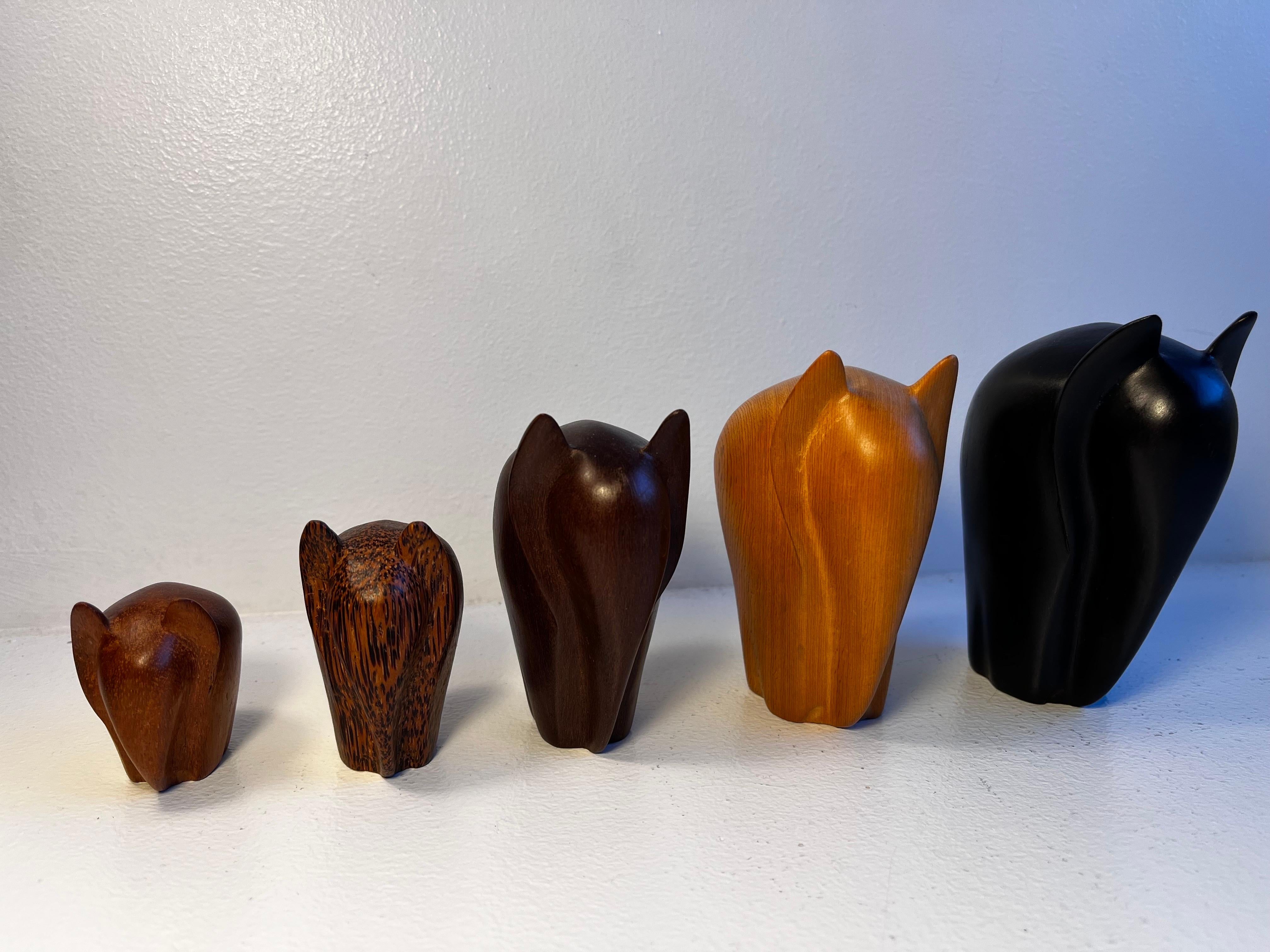 Hardwood Set of five carved modernist Elephants in a mix of woods For Sale
