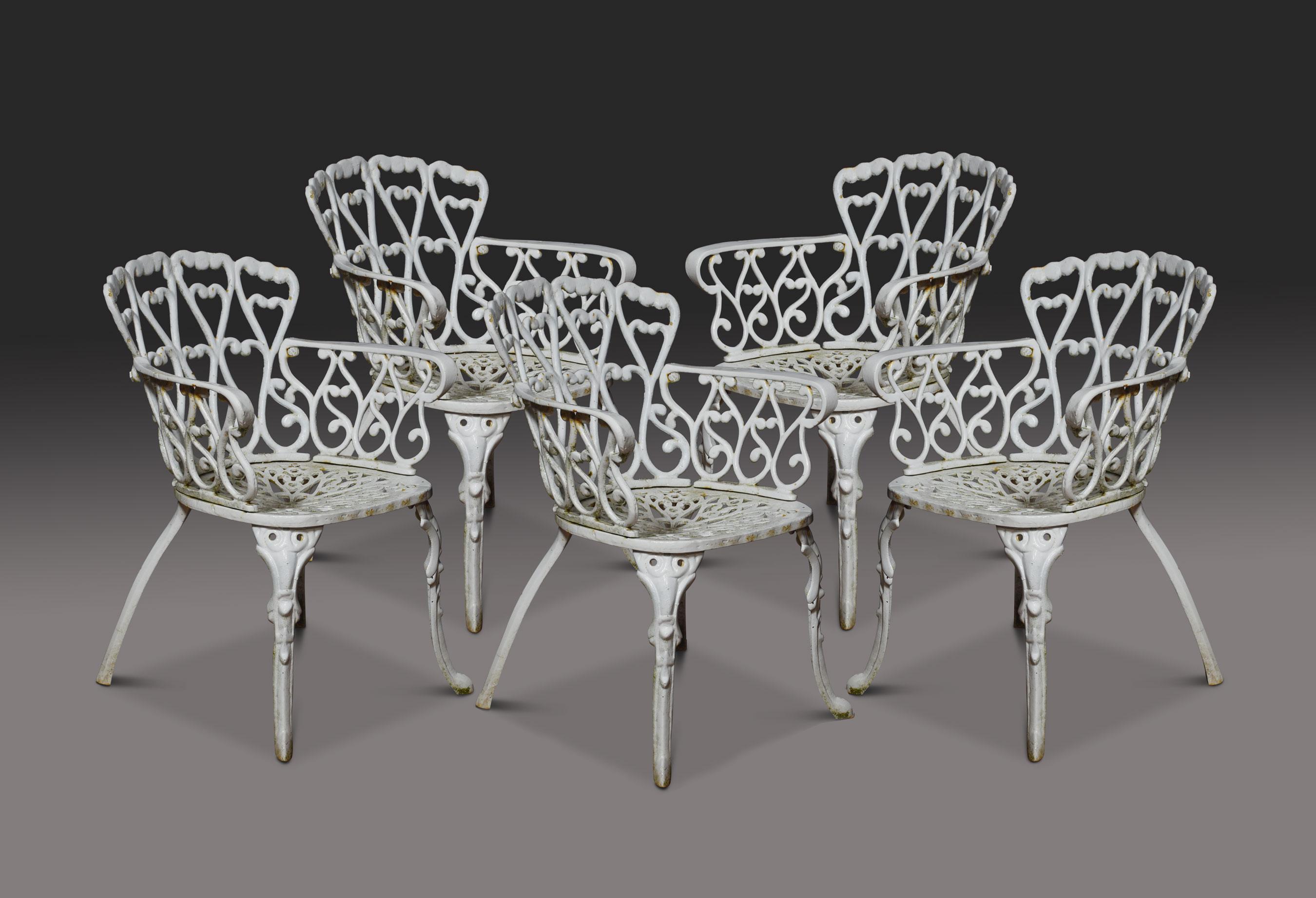 Set of five cast iron Coalbrookdale style garden chairs For Sale