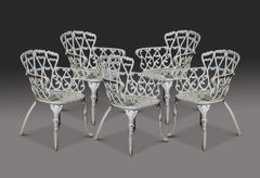 Set of five cast iron Coalbrookdale style garden chairs