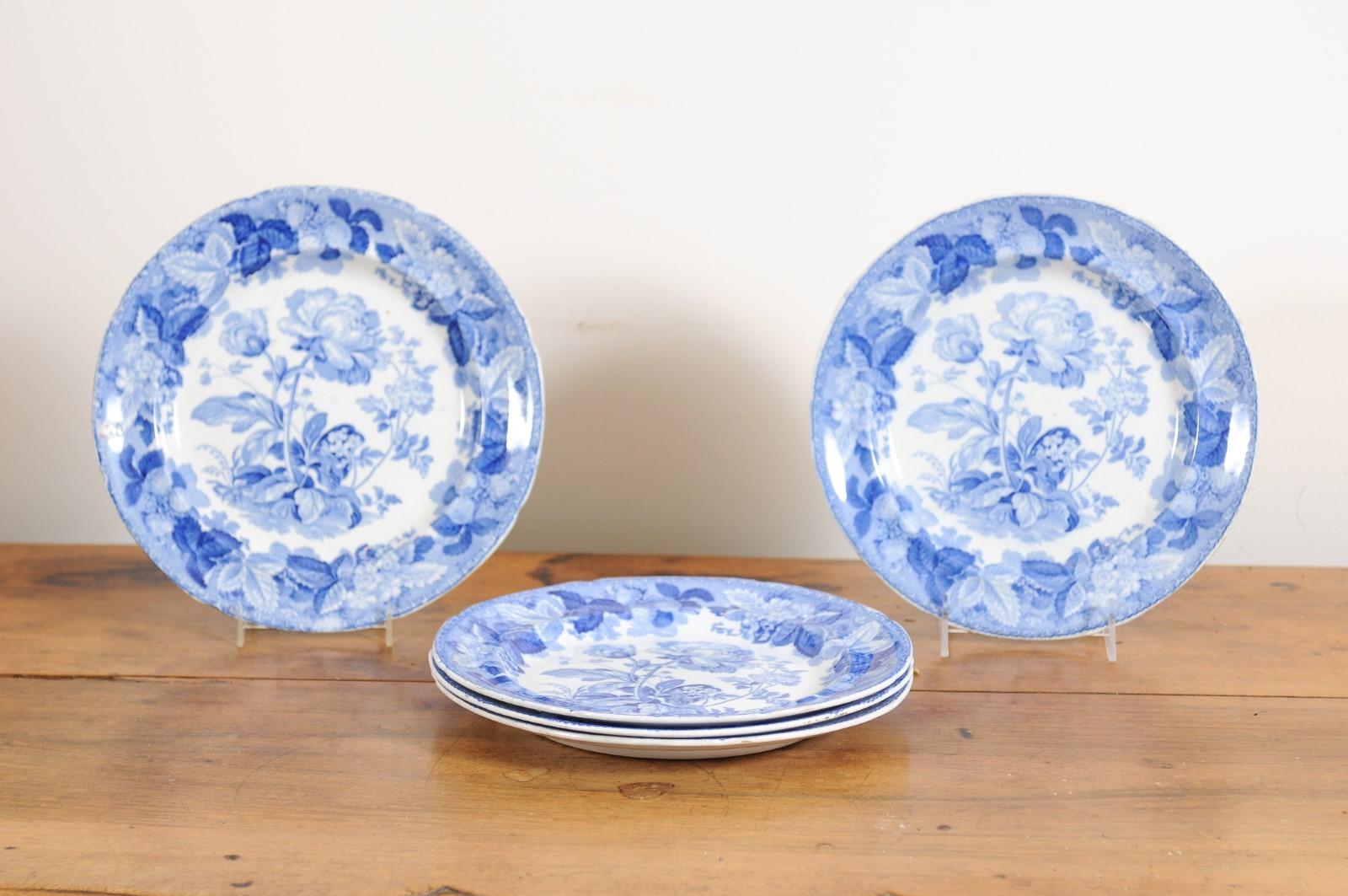 A set of five English blue and white porcelain plates from the 19th century, with rare floral pattern. Created in England during the 19th century, these plates can also be used as bowls. Adorned with a blue and white décor showcasing a rare floral