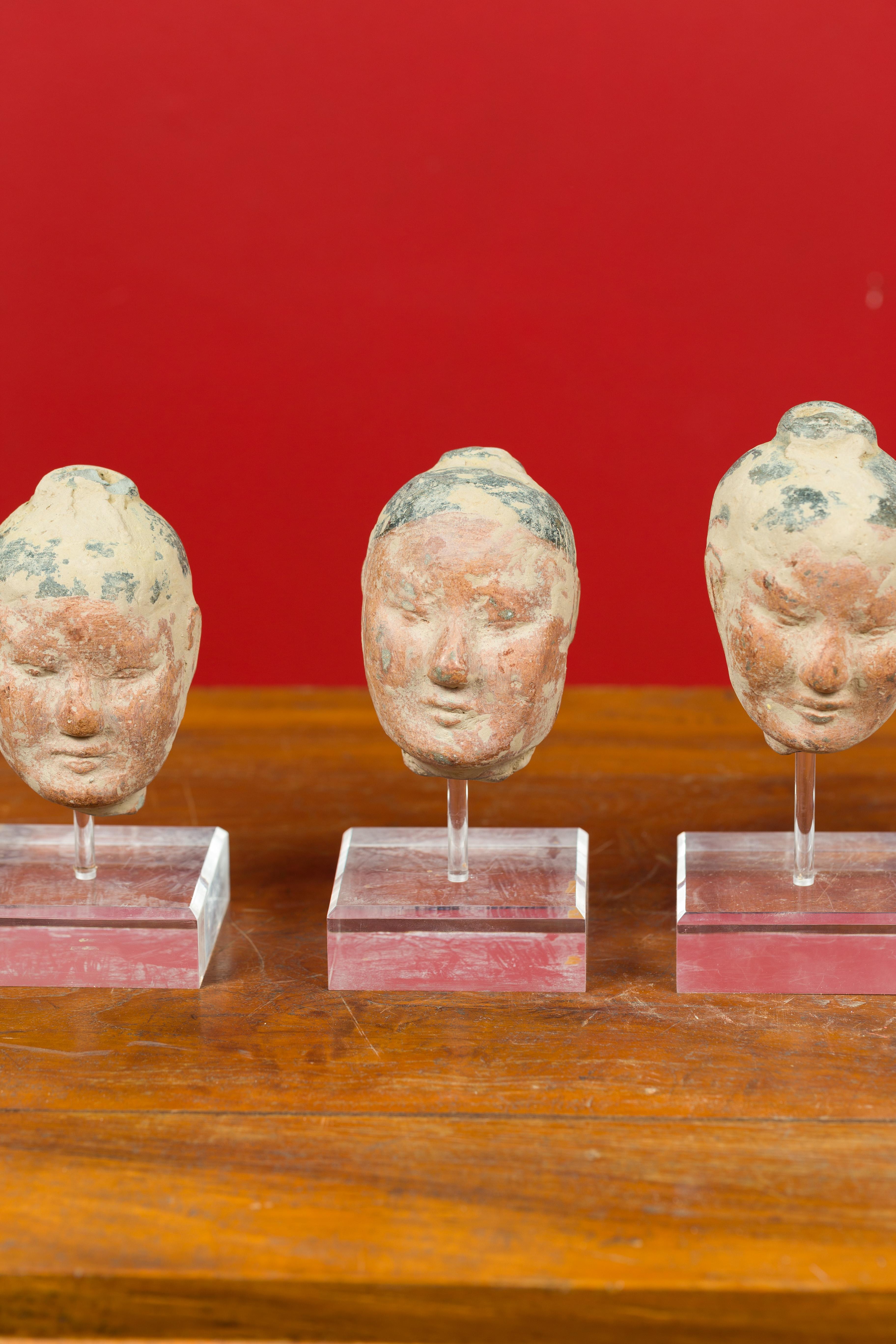 Set of Five Chinese Han Dynasty Terracotta Heads with Original Paint on Lucite In Good Condition In Yonkers, NY