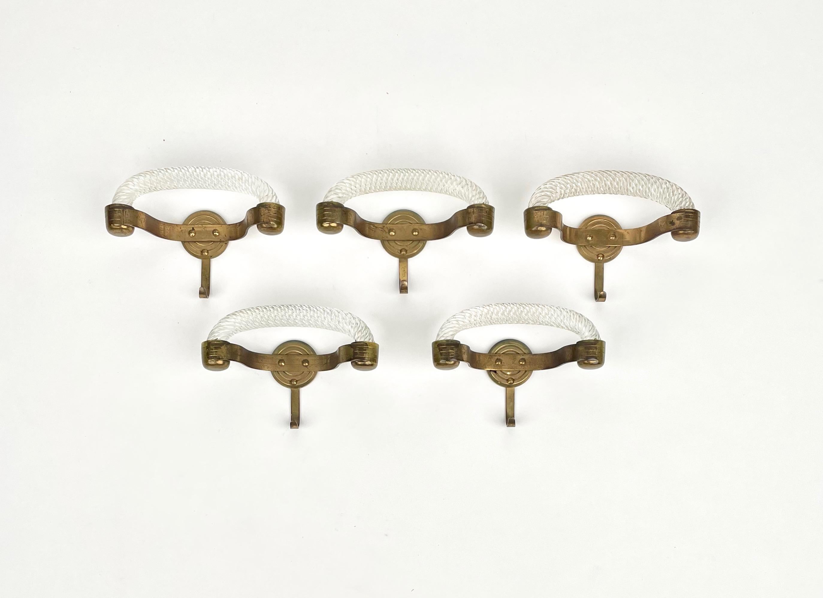 Set of five coat hangers in Murano glass with brass hooks by Venini. Produced in Italy in the 1940s.