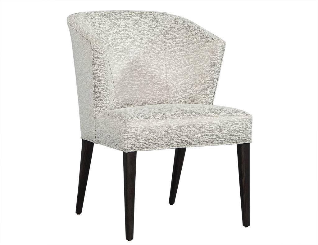 Set of five custom curved back modern dining chairs by Carrocel. Custom-made by Carrocel, designed with an elegant curved contour back, flowing into four graceful tapered legs. These chairs can be custom ordered to match any interior design and are