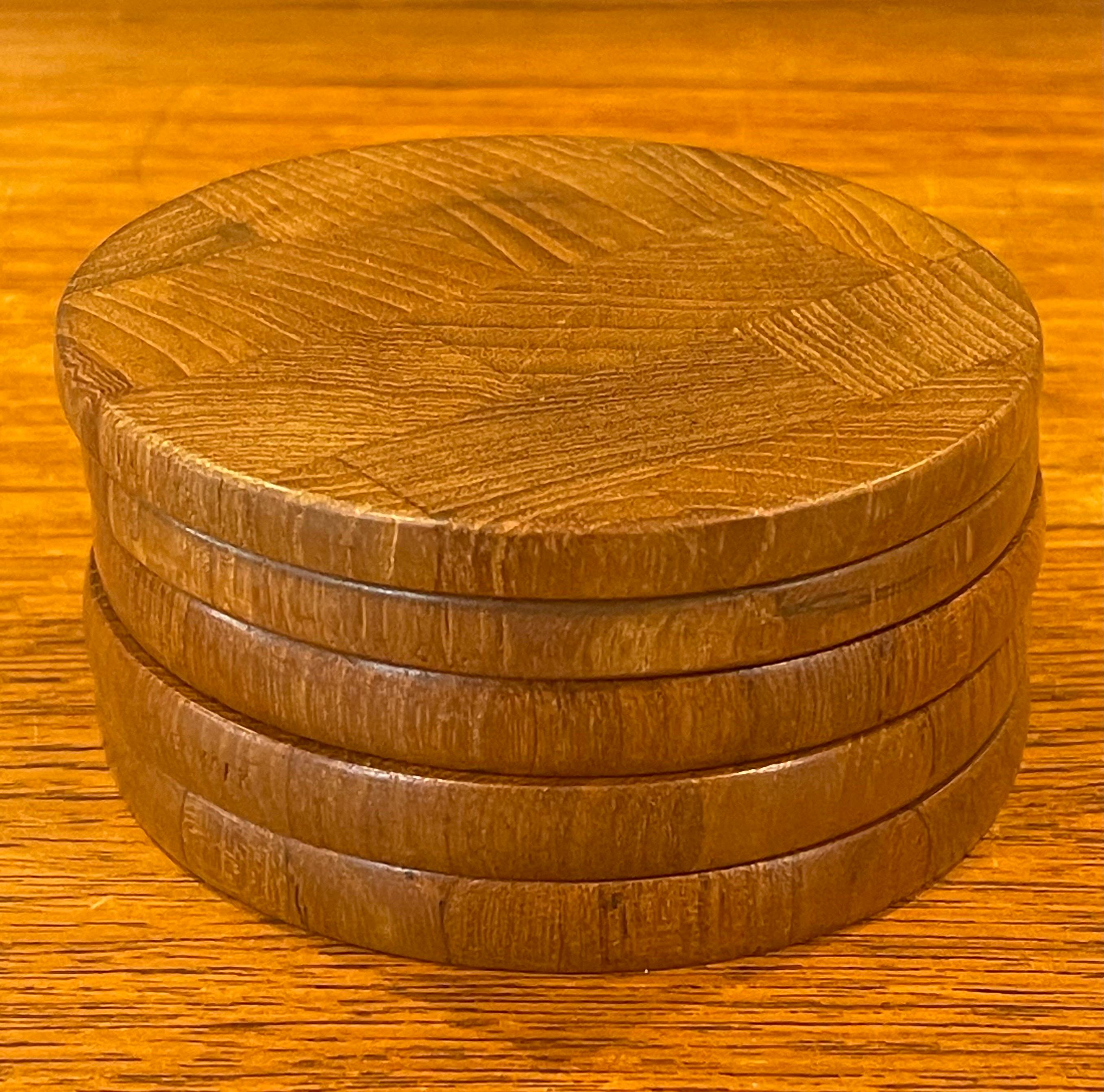 Nice set of five Danish modern staved teak coasters by Dansk, circa 1970s. The coasters are in very good vintage condition and measure 3.75