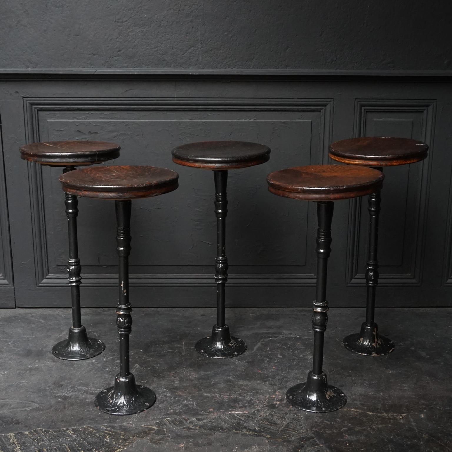 Set of five 1910 antique heavy industrial elevator cab or car operator's revolving stools with original oakwood seat and cast iron base.

All five are a little bit different in height varying from: 63cm (24.8 inch), 63.5cm (25 inch), 64cm (25.2