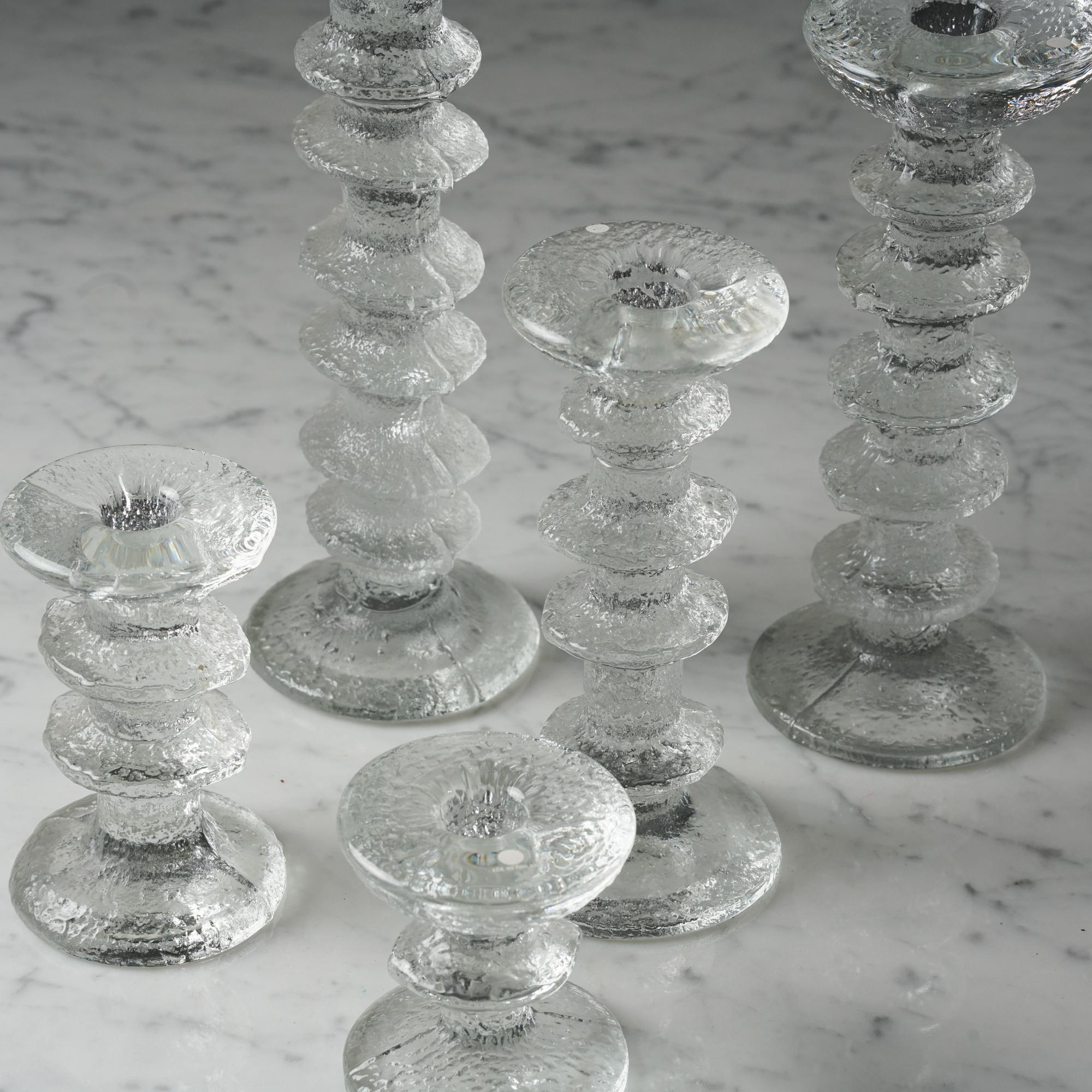 Set of five 'Festivo' candleholders by Timo Sarpaneva for Iittala, 1970s. Beautiful timeless design.

Measurements for the smallest candleholder : diameter for the bottom 7 cm, height 8 cm 
Measurements for the tallest candleholder: 9 cm, height 24