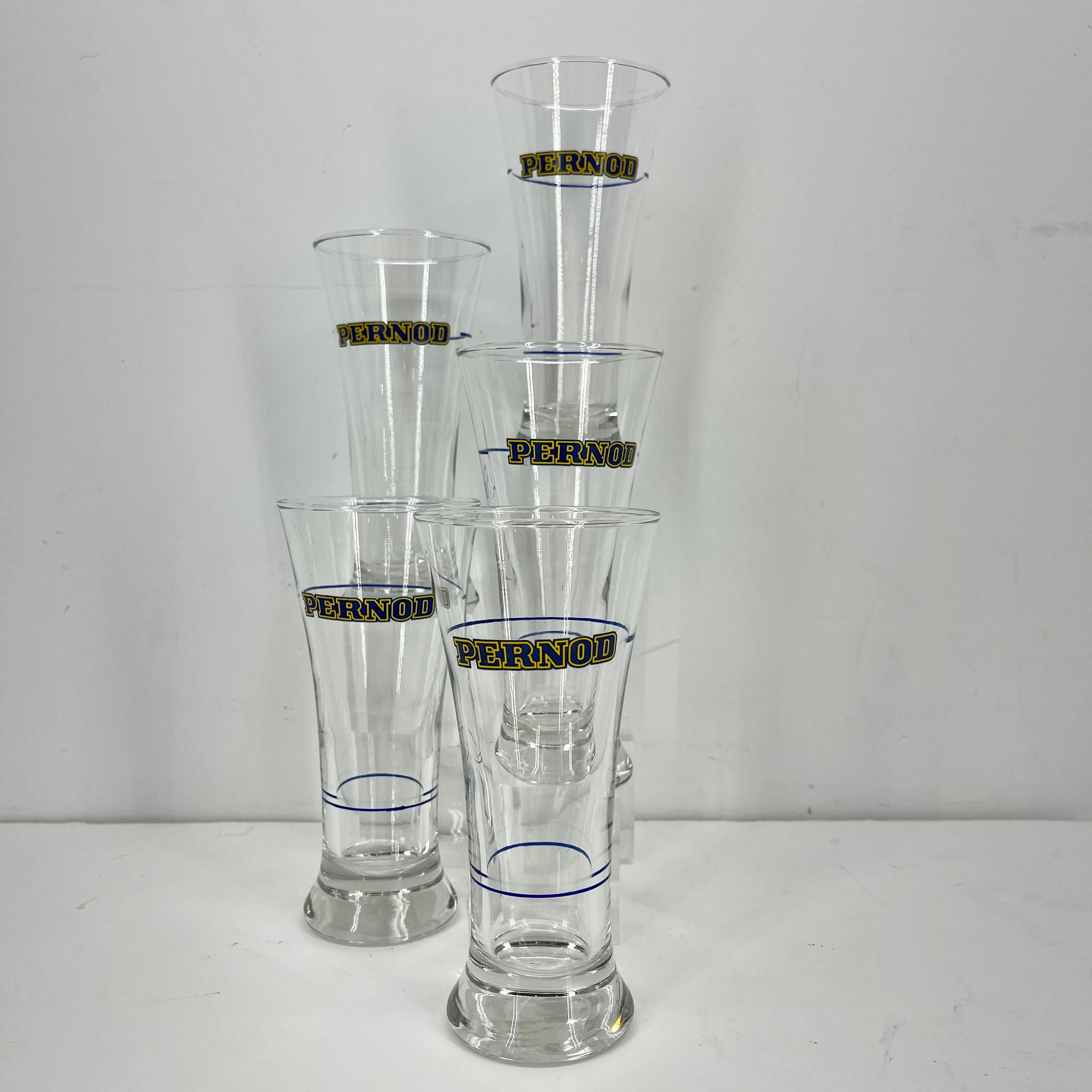 5 French Pernod glasses set in yellow with blue striping for measuring.
Pernod Fils was the most popular brand of absinthe throughout the 19th and 20th century. Pernod originally built a large distillery in Pontarlier, France, in 1805.
Straight