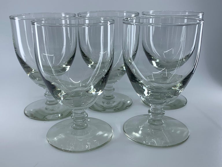 Set of five glass goblets. Baluster-footed hand blown water glasses, England, early 20th century.
Dimensions: 3.38