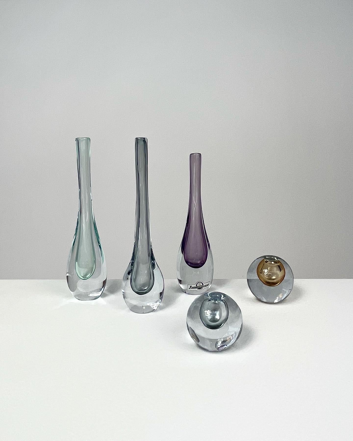 Set of five miniature vases by Asta Strömberg & Gunnar Nylund for Strömbergshyttan glass factory in the late 1950s-early 1960s.

Height: 3.5 cm, 4 cm, 13.5 cm, 14.2 cm, 14.5 cm

The amber ball vase is signed underneath, the light purple remains the