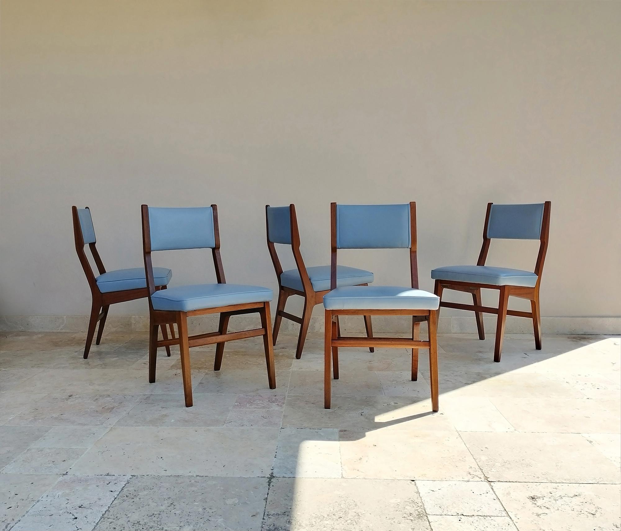 Five chairs with a fantastic design produced in the 1950s by the well know italian manufacturer ISA Bergamo and attributed to Gio Ponti. 
The chairs are in very good conditions, recently reupholstered in excellent quality leather. 
These elegant